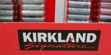 I compared Costco shopping carts of Kirkland Signature products and brand names. The price differences surprised me.