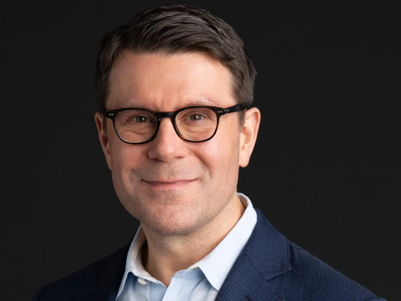 Headshot of Cubist head Geoffrey Lauprete