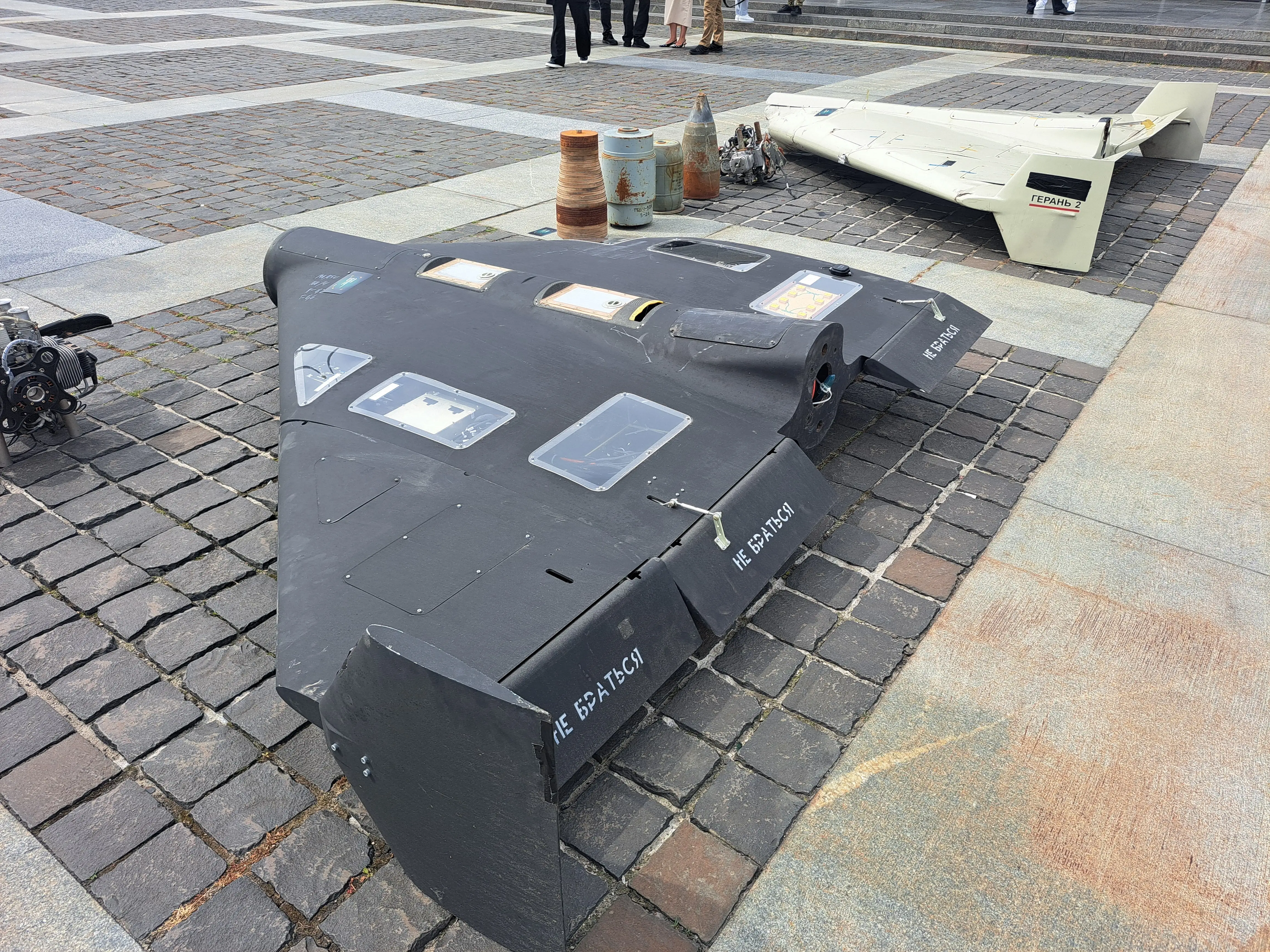 Geran-2 drones lie on a cobblestone street in Kyiv.
