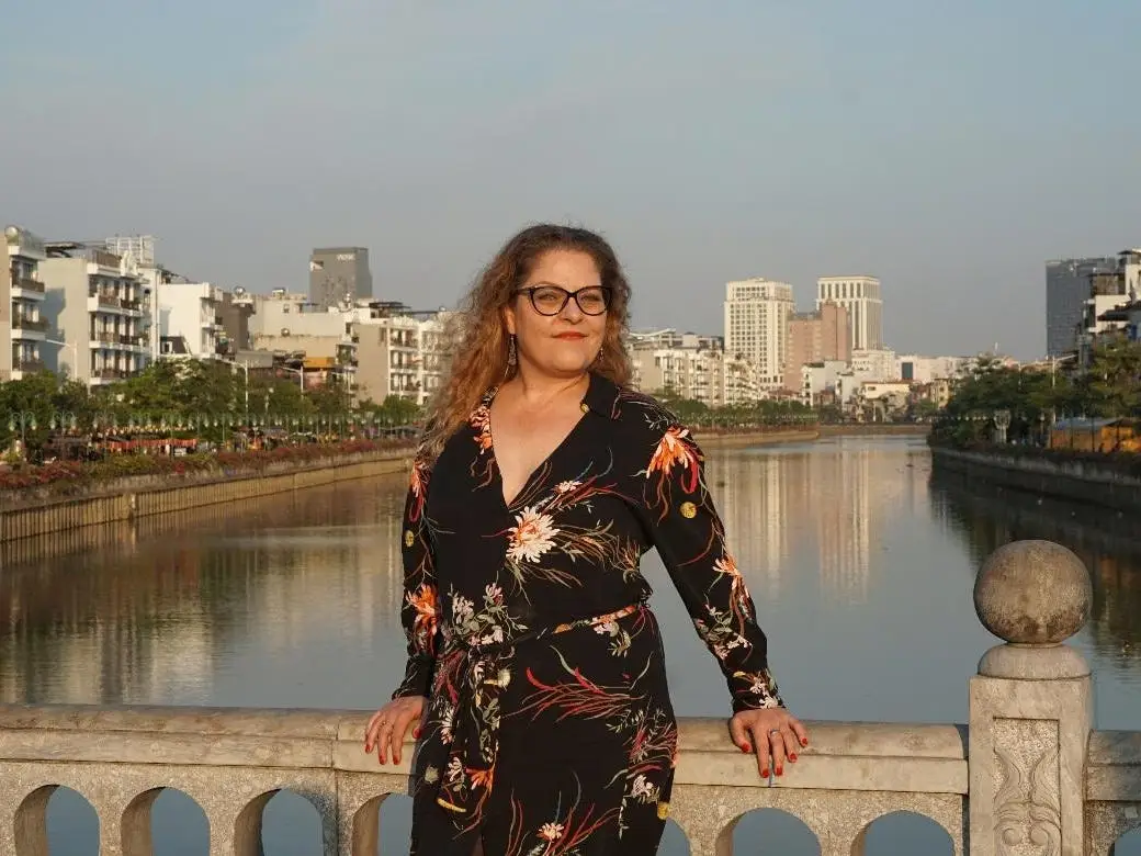 Deidre Donnelly posing near the water in Haiphong, northern Vietnam.