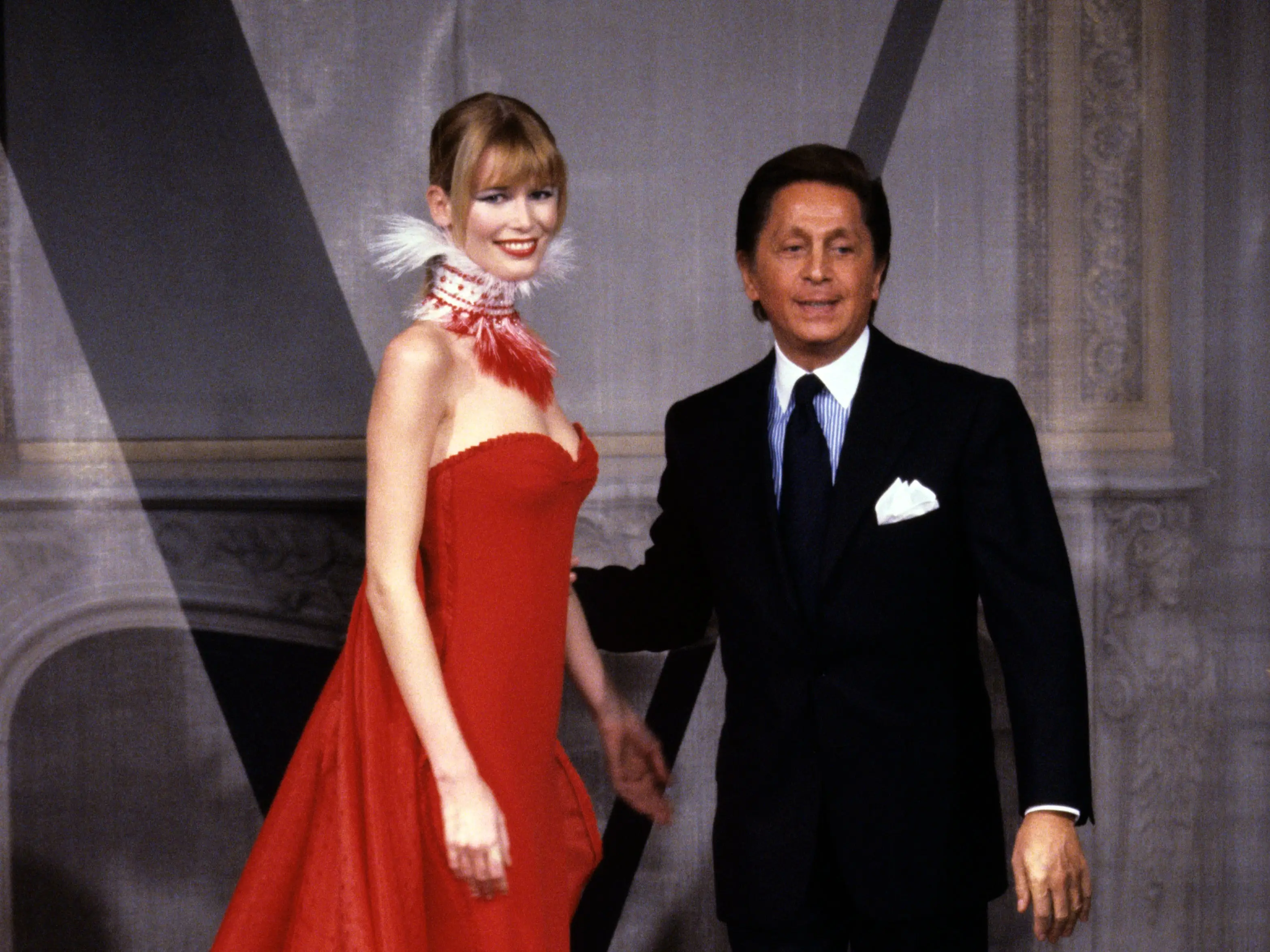 Valentino Garavani on the runway with model Claudia Schiffer during the finale of his spring 1998 couture collection.