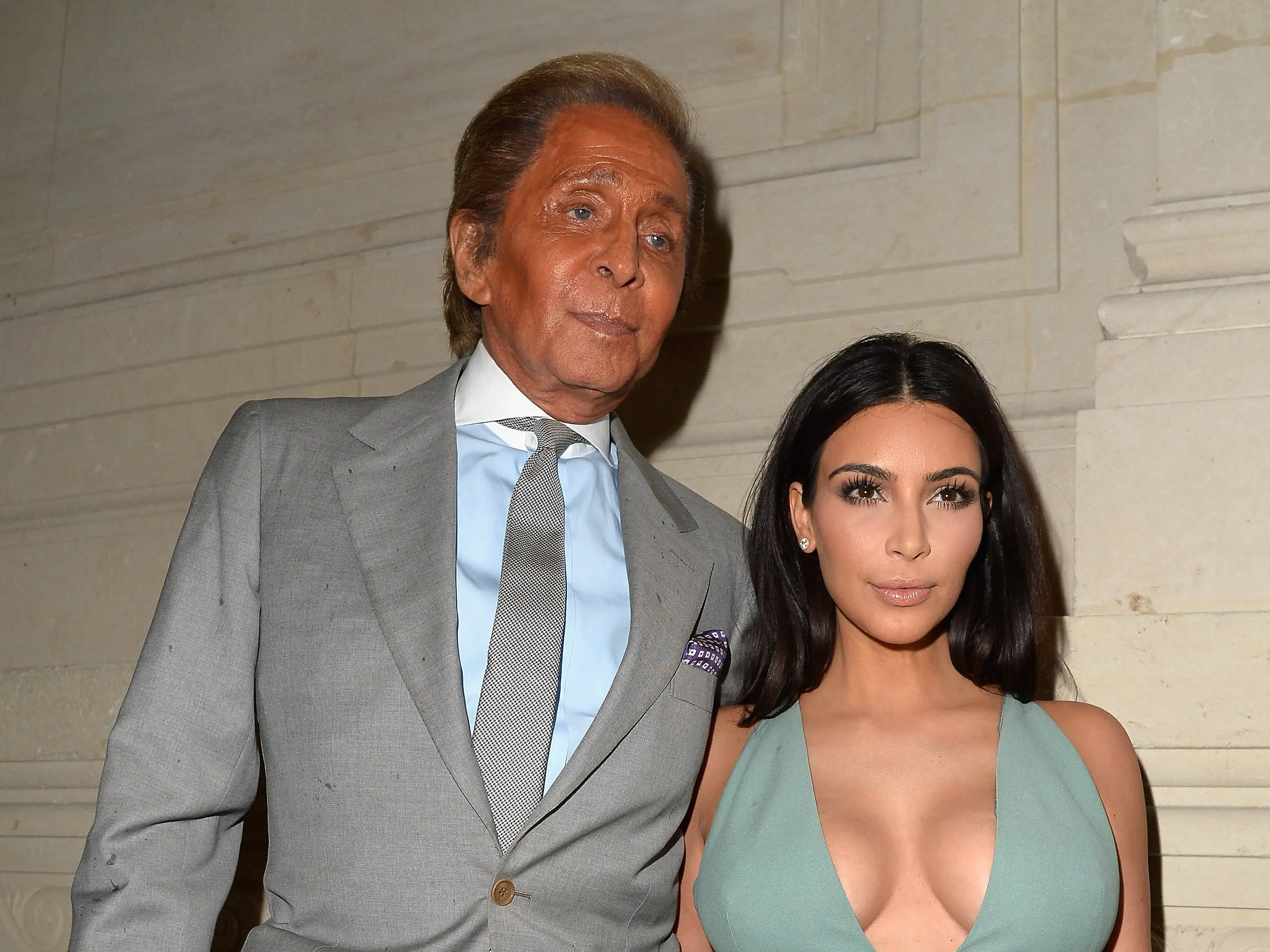 Valentino Garavani and Kim Kardashian attend the Valentino show at Paris Fashion Week in 2014.