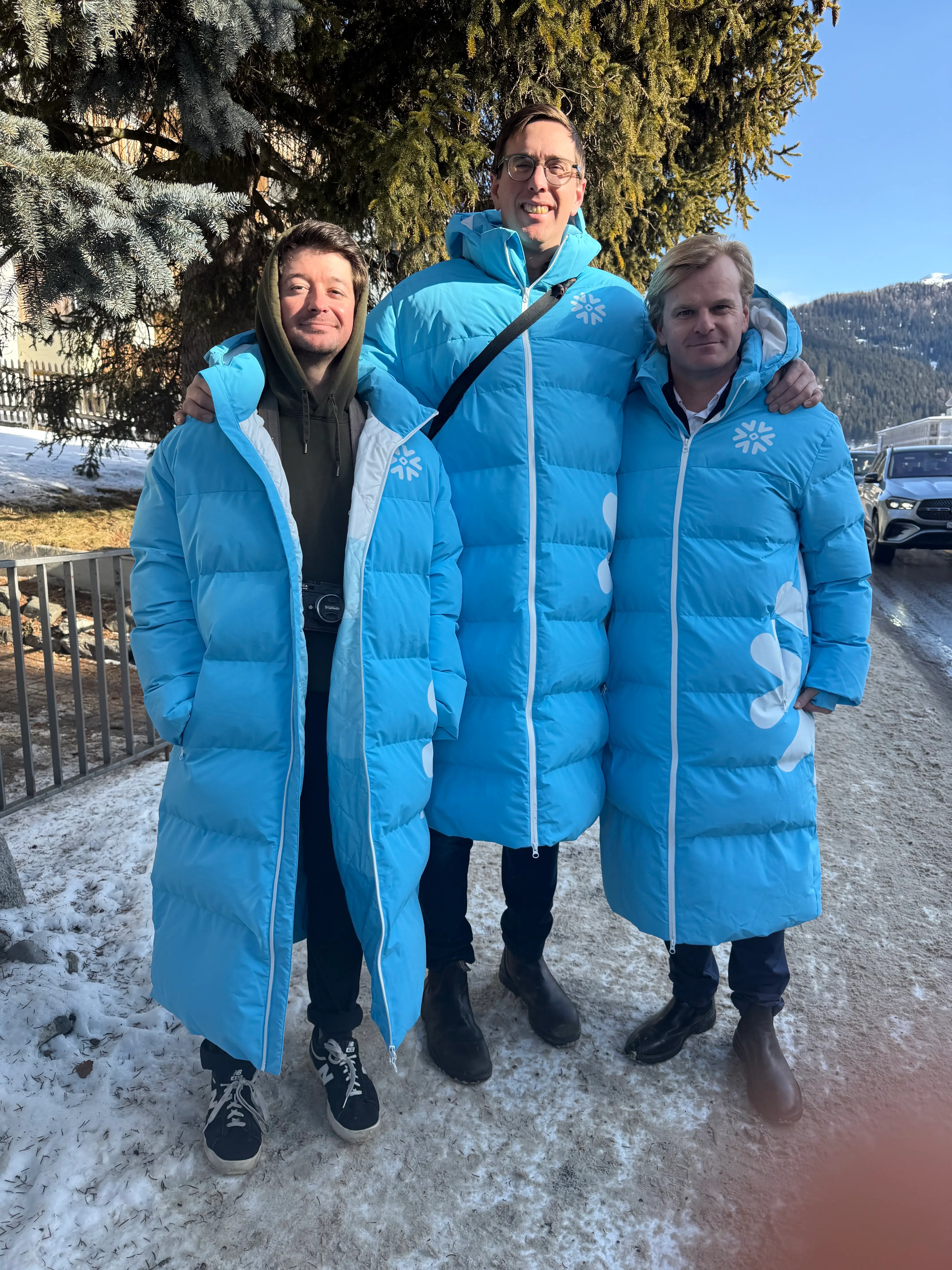 Three Snowflake staffers wore parkas in Switzerland with the company logo at the World Economic Forum