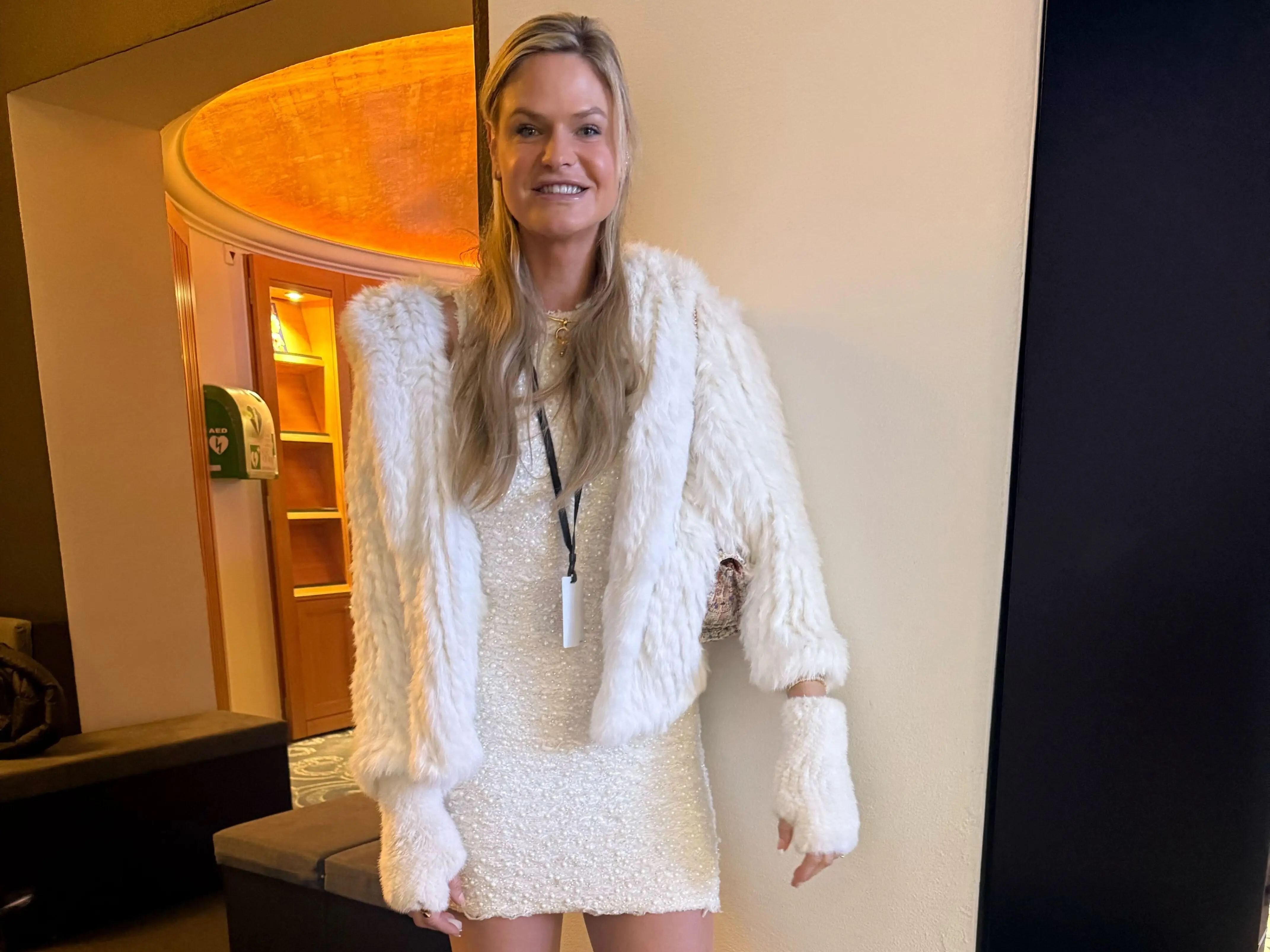 Kayla Peterson, director of partnerships at AI Wellness, pictured in an all-white outfit at the World Economic Forum in Davos, Switzerland.