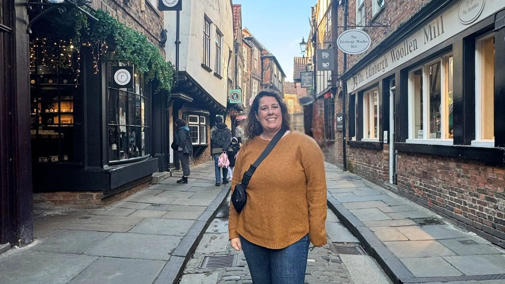 Author Chantelle Kincy standing in cobblestone alley way in york