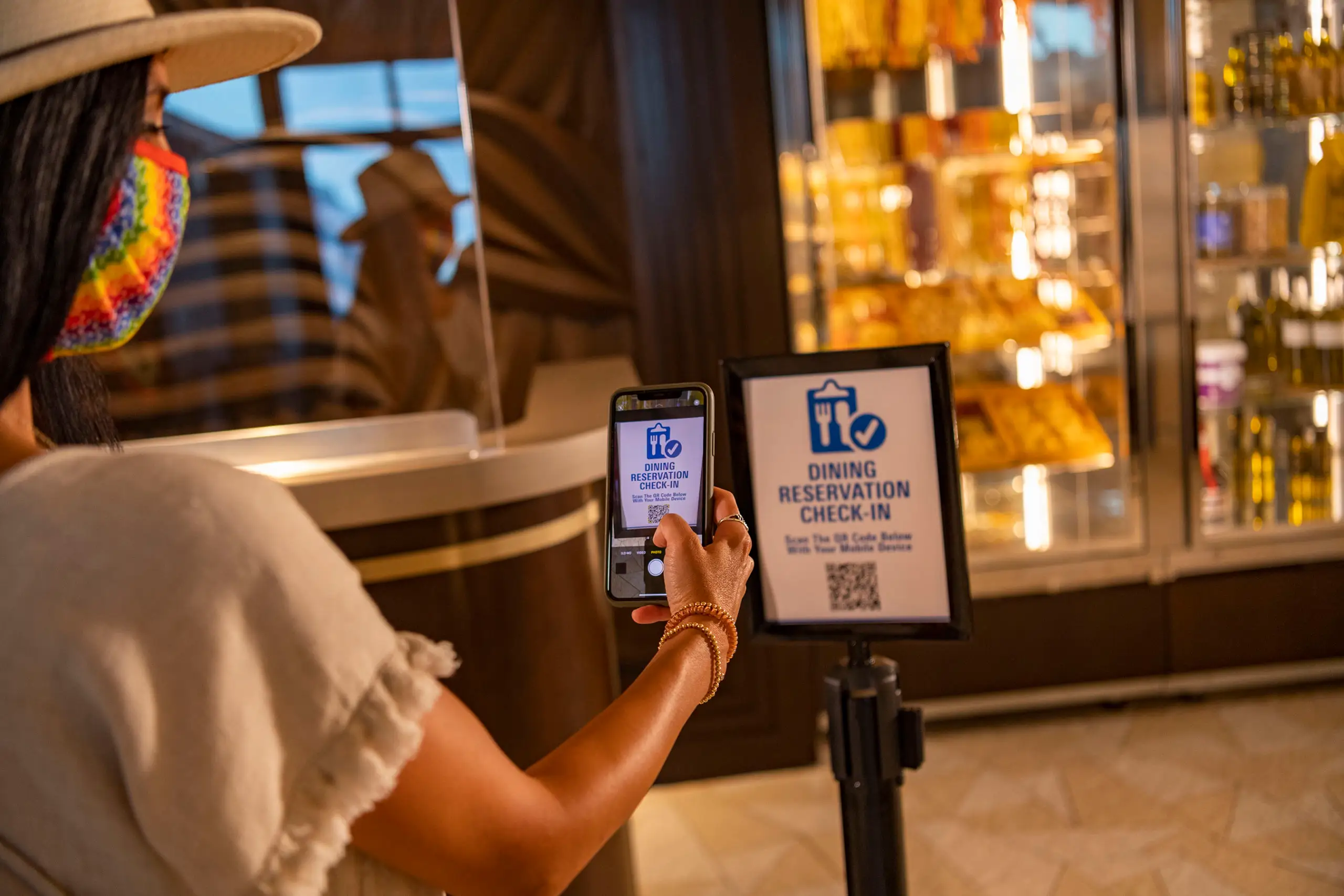 Person checking into dining reservation on phone