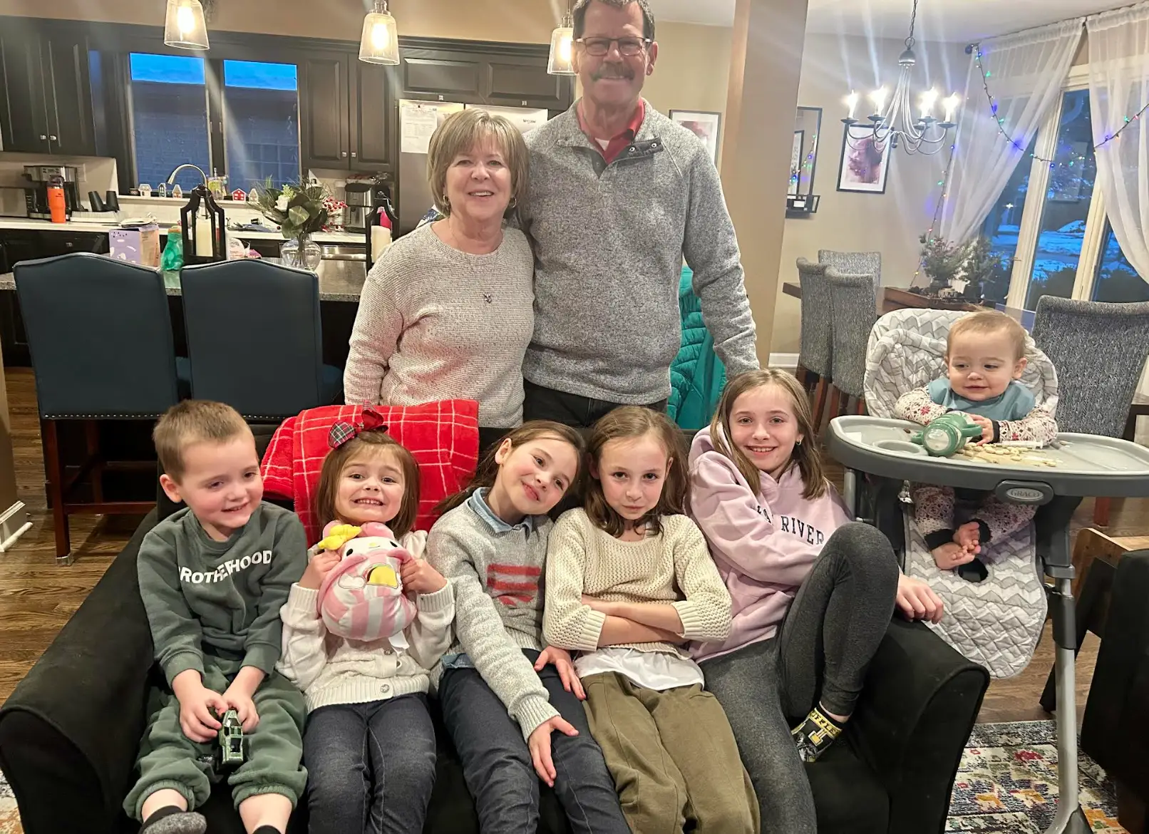 The writer's kids and neighbors posing together in her living room.