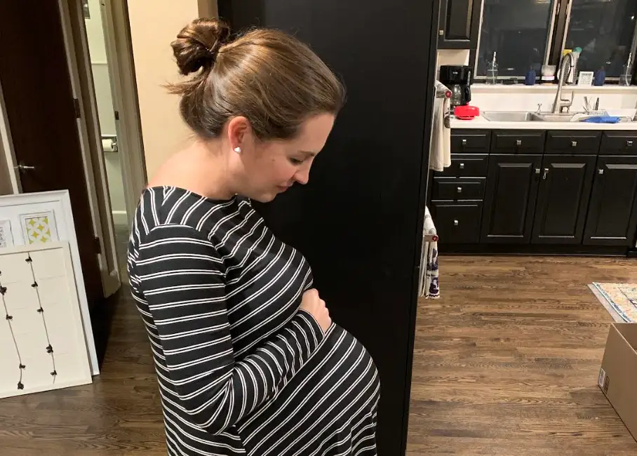 The writer posing in her new kitchen.