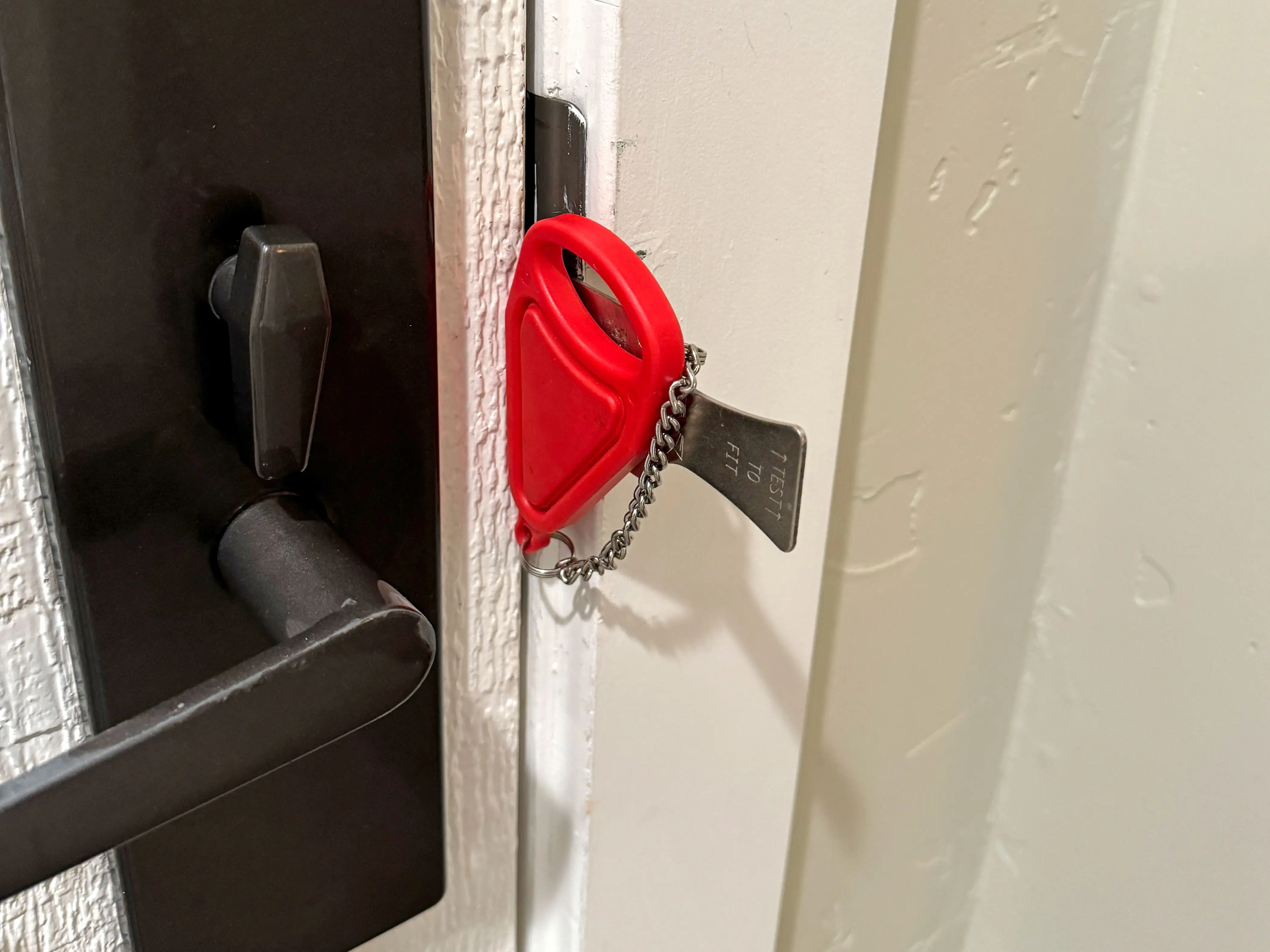 An additional locking device in the crease of a door.