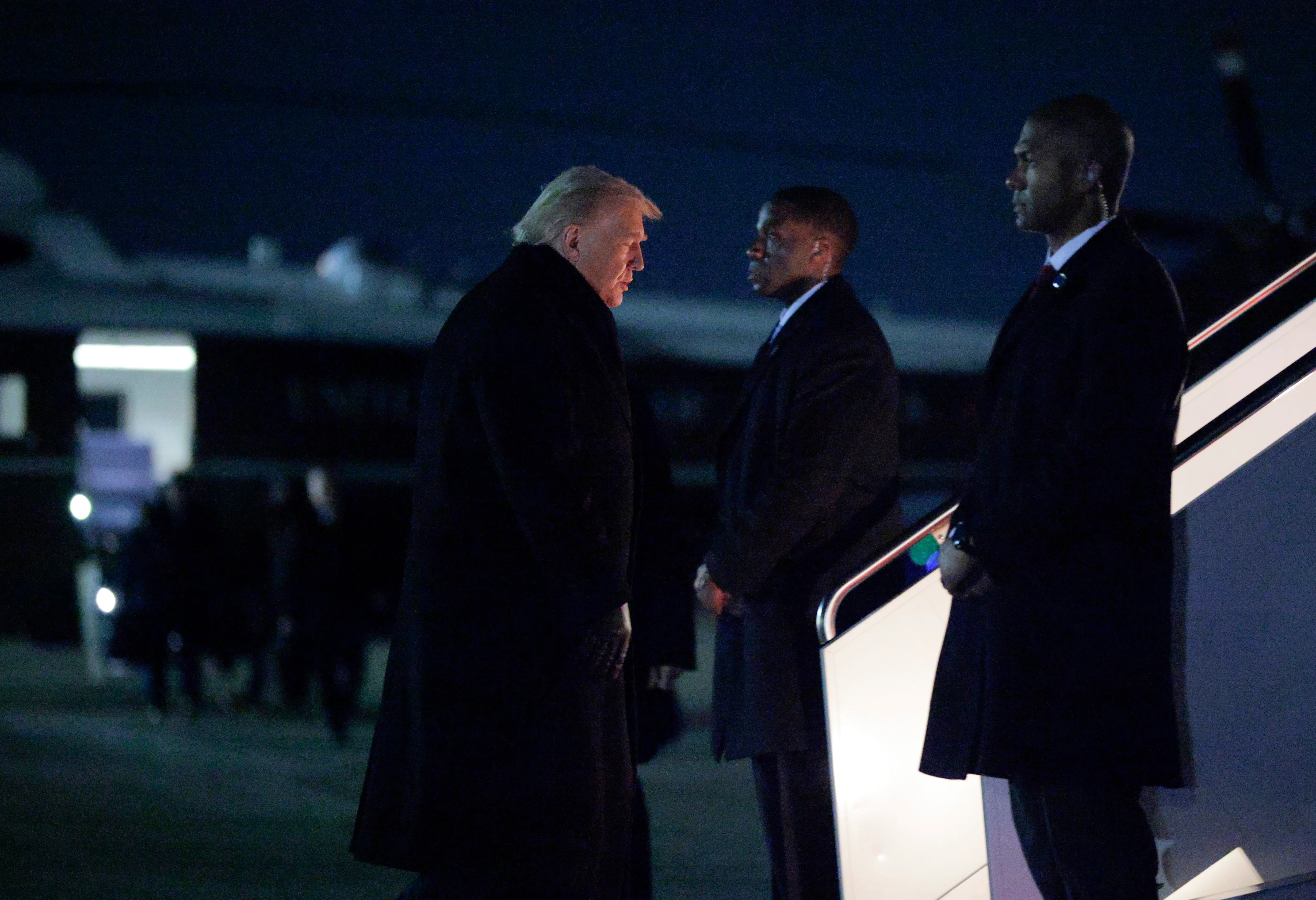 US President Donald Trump walks to board Air Force One en route to Switzerland on January 20, 2026, at Joint Base Andrews, Maryland. Trump is traveling to Davos, Switzerland, to attend the World Economic Forum.