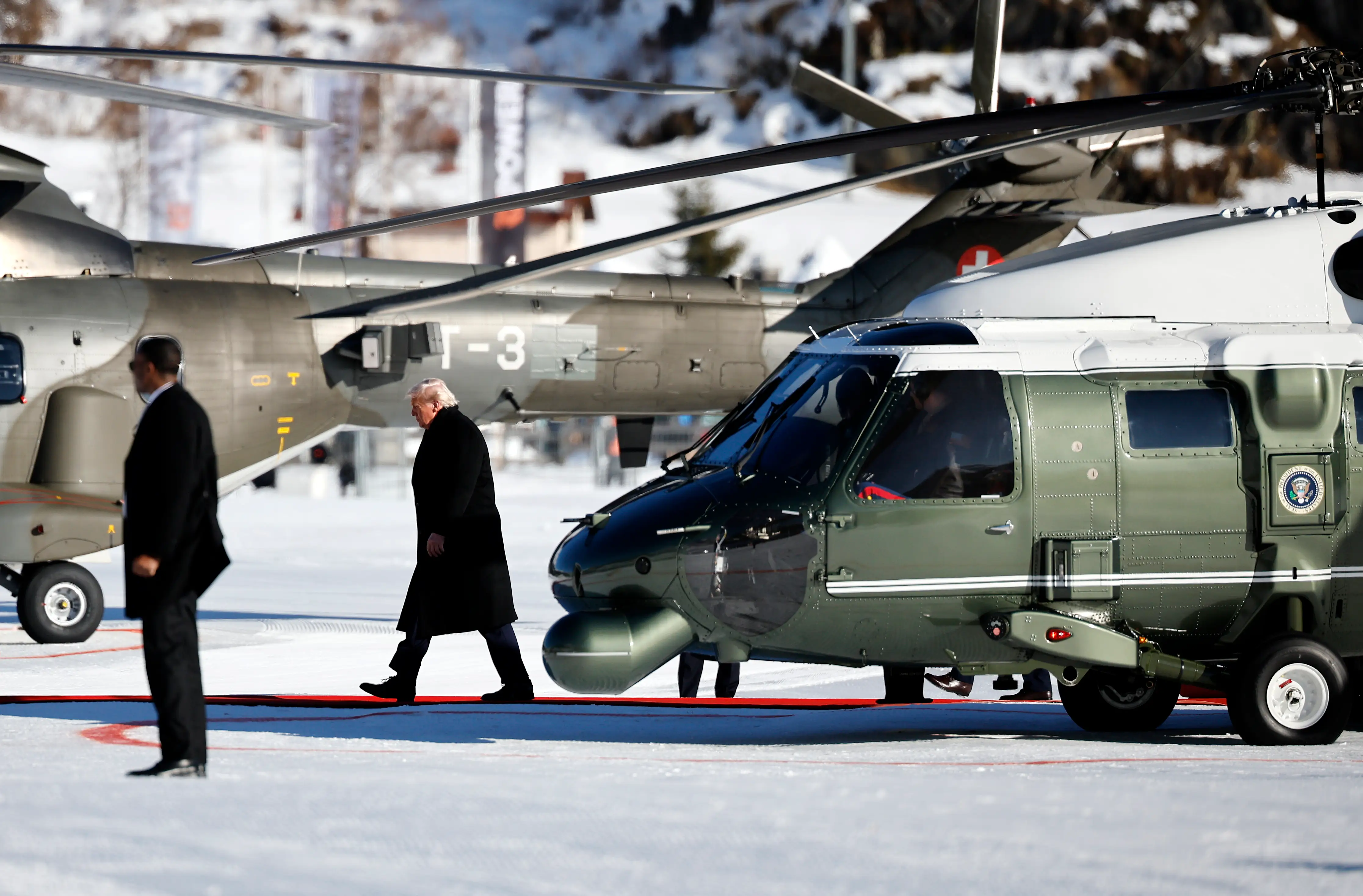 President Donald Trump disembarks Marine One as he arrives in Davos to attend the World Economic Forum