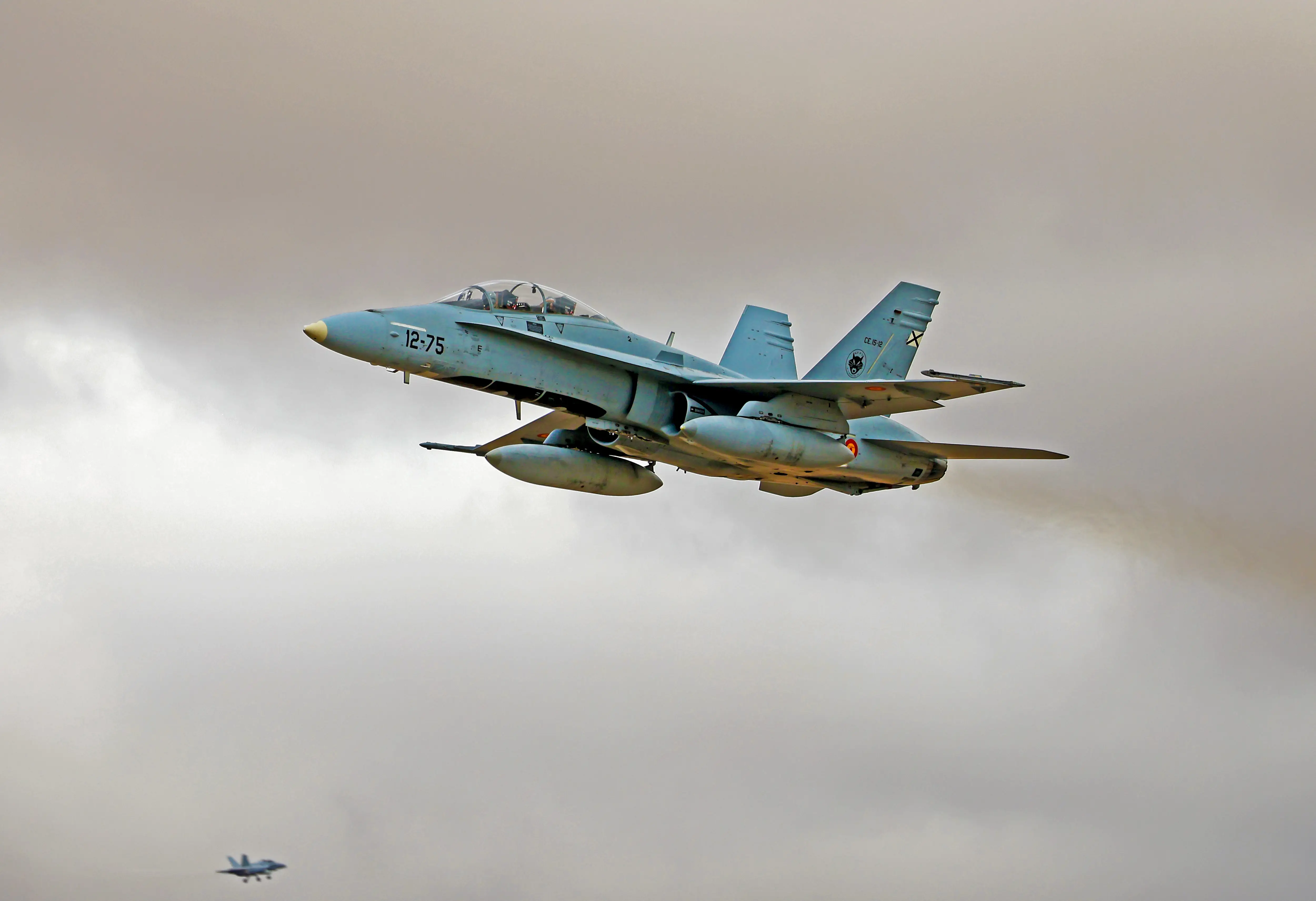 A McDonnell Douglas EF-18B Hornet of the Spanish Air Force flies over the Torrejon de Ardoz military base in Madrid, Spain, on October 12, 2025.