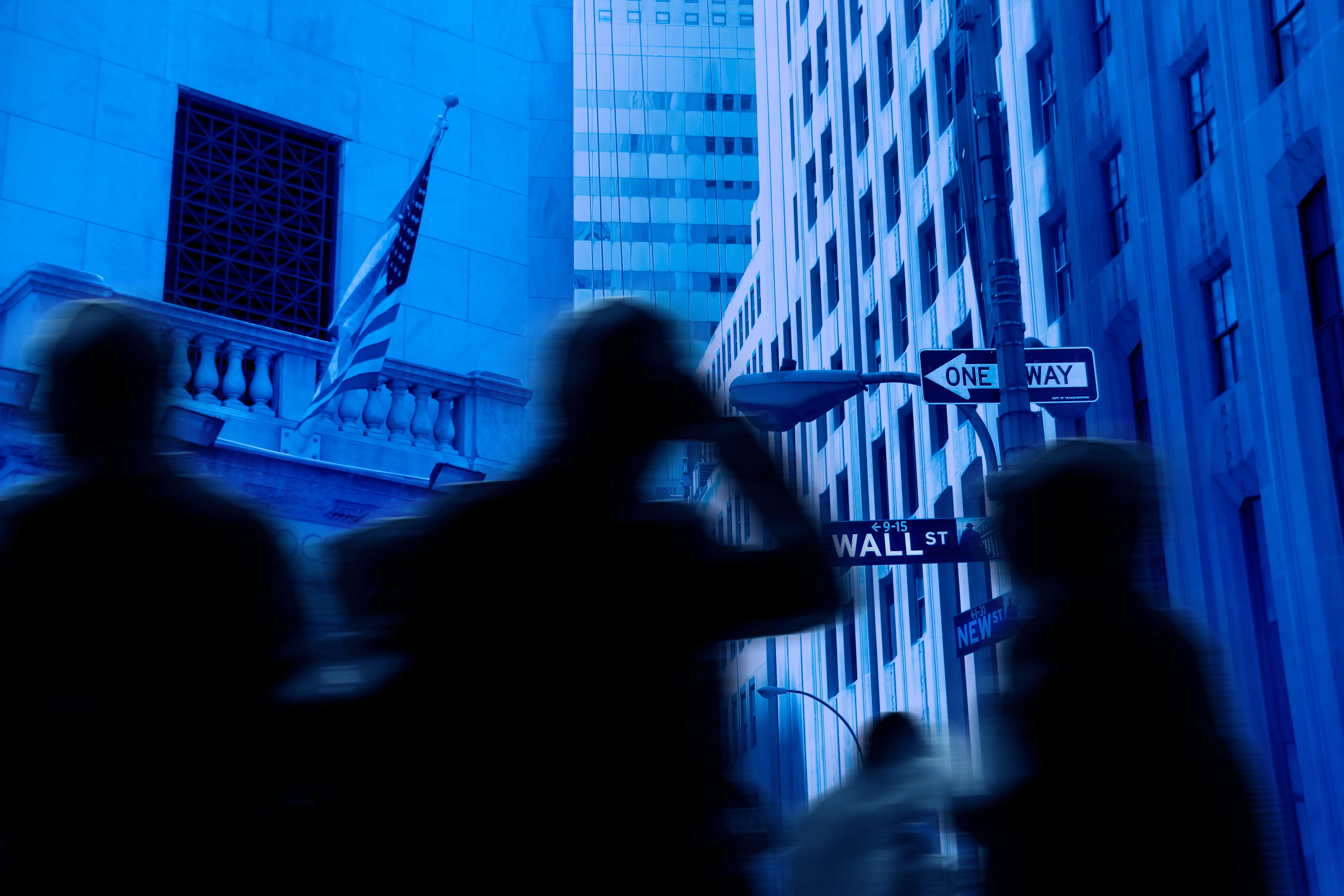 composite of Wall Street and blurry figures