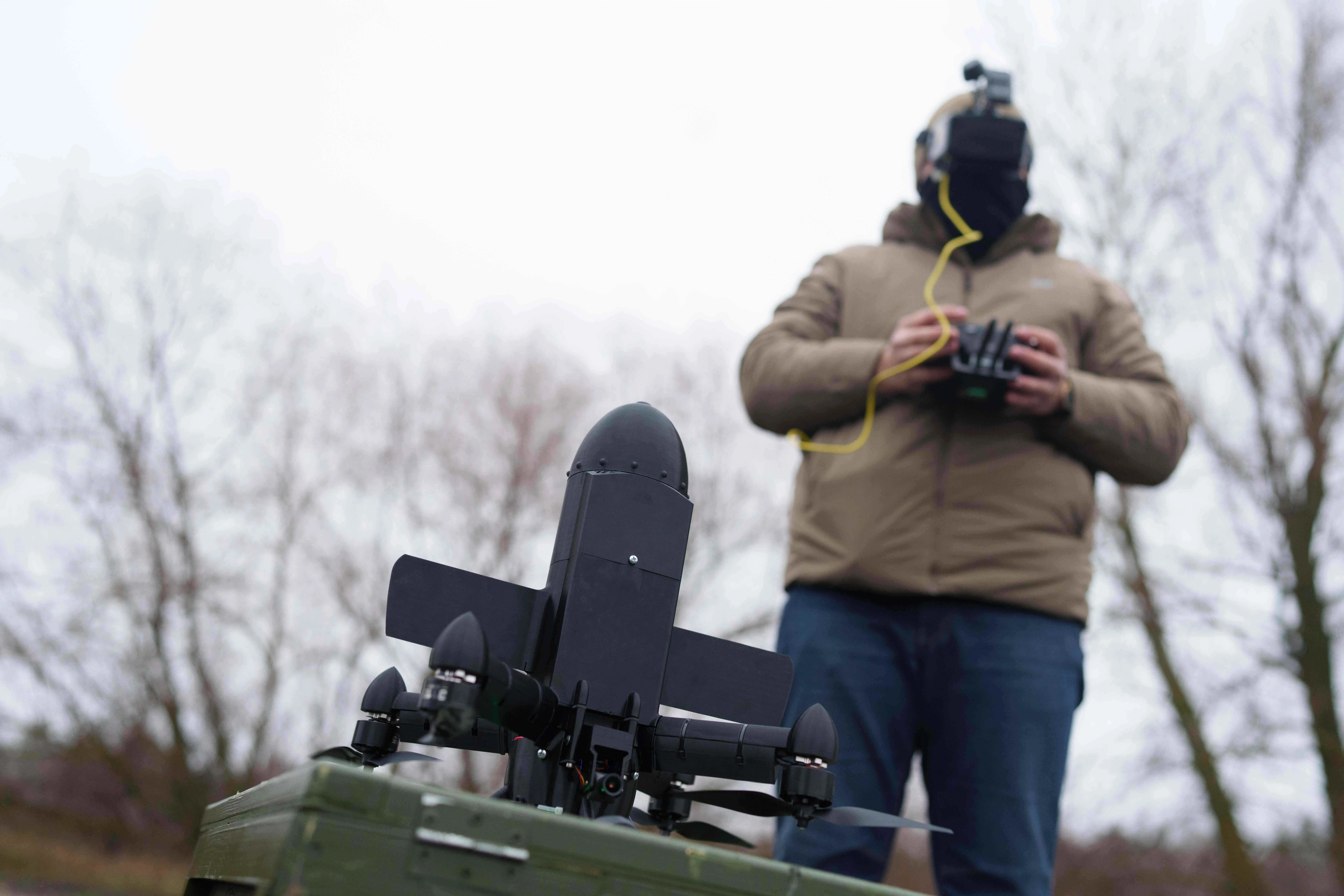 A serviceman prepares an interceptor drone of 
