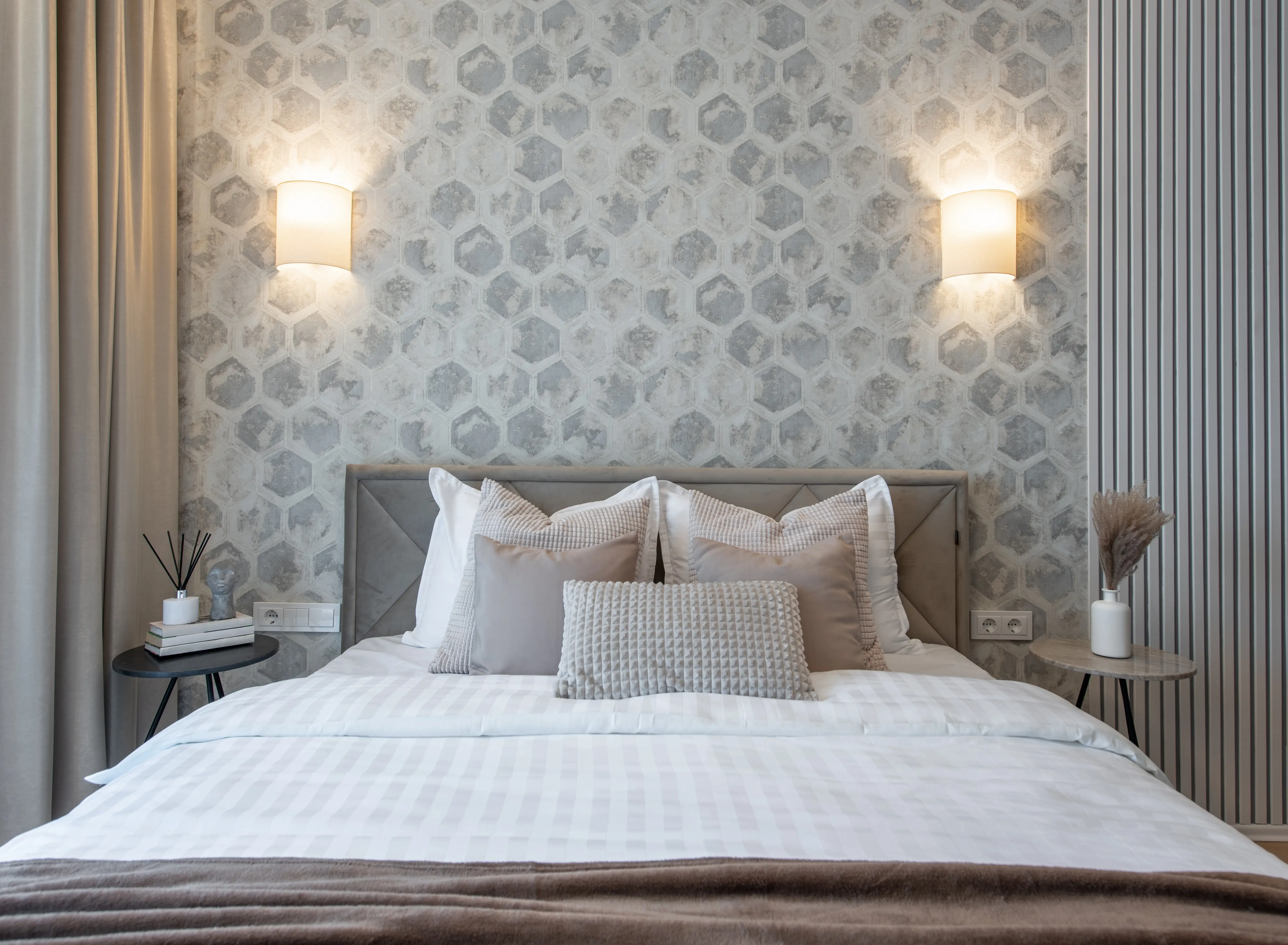 Bedroom with backlights and wallpaper behind bed