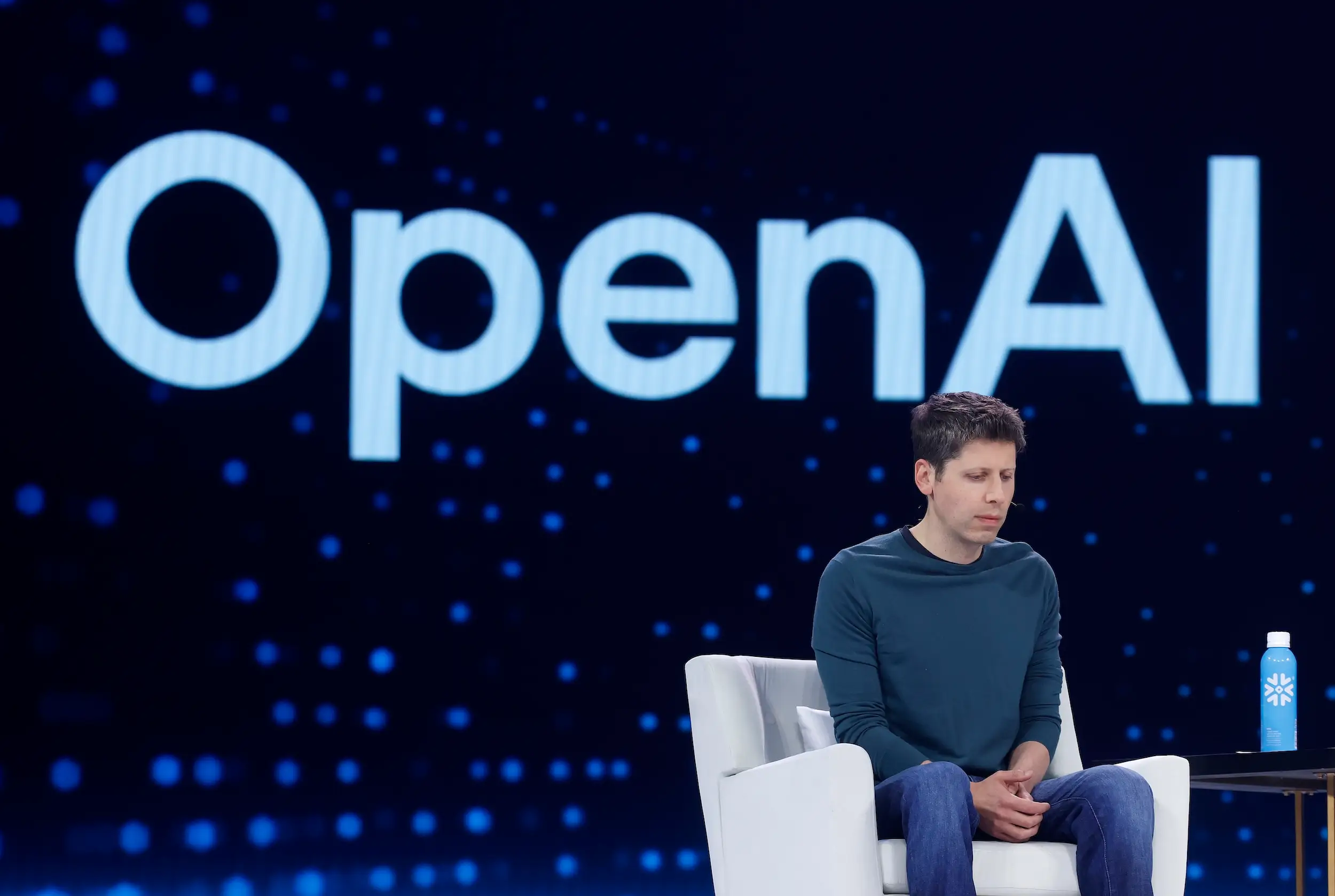 Sam Altman looks down during an OpenAI event