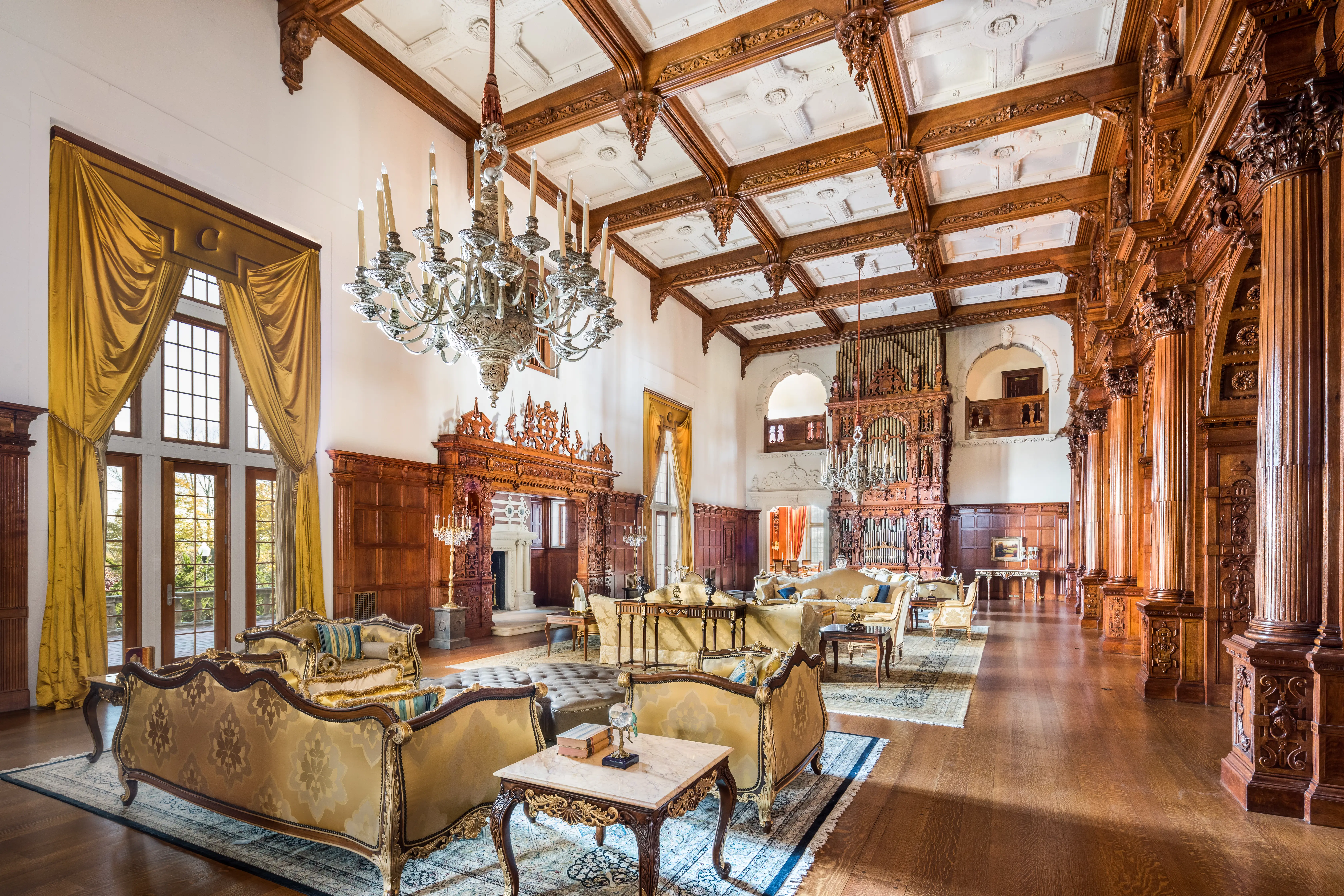 The Great Hall of the Crocker-McMillin mansion has 30-foot, coffered ceilings and two chandeliers.