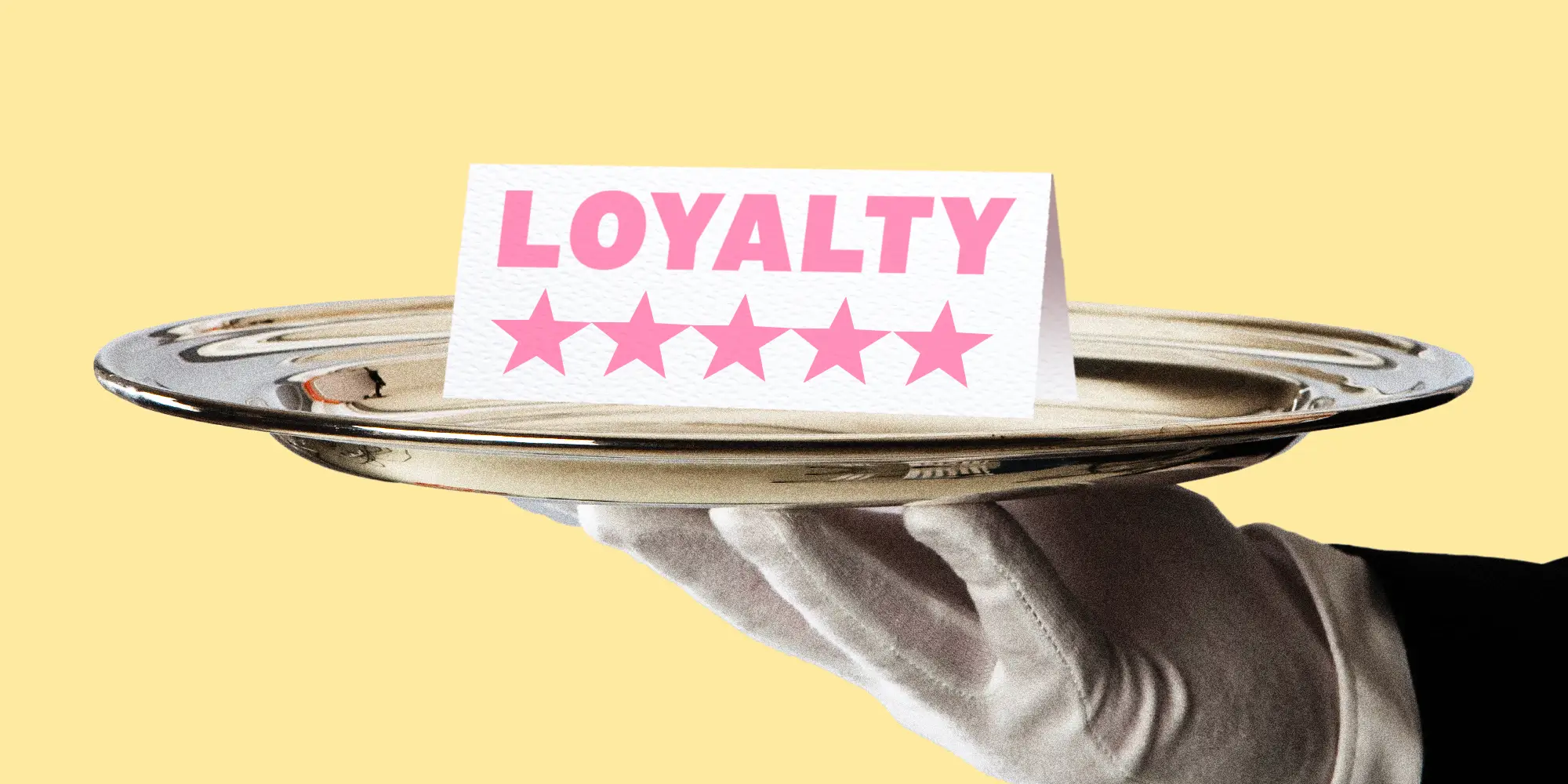 A silver platter with a loyalty card sitting on top