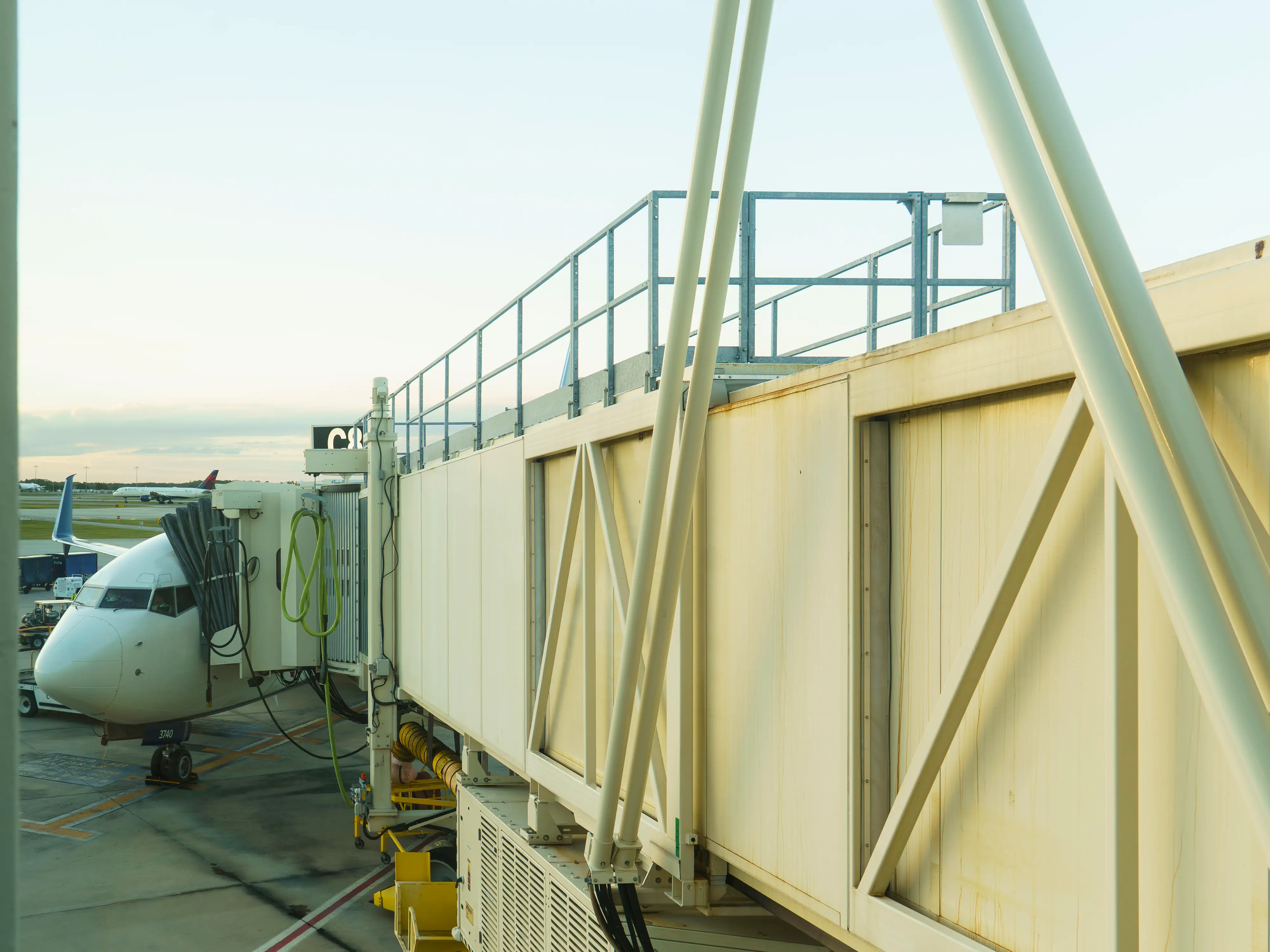 A view of a plane at a gate from the jet bridge