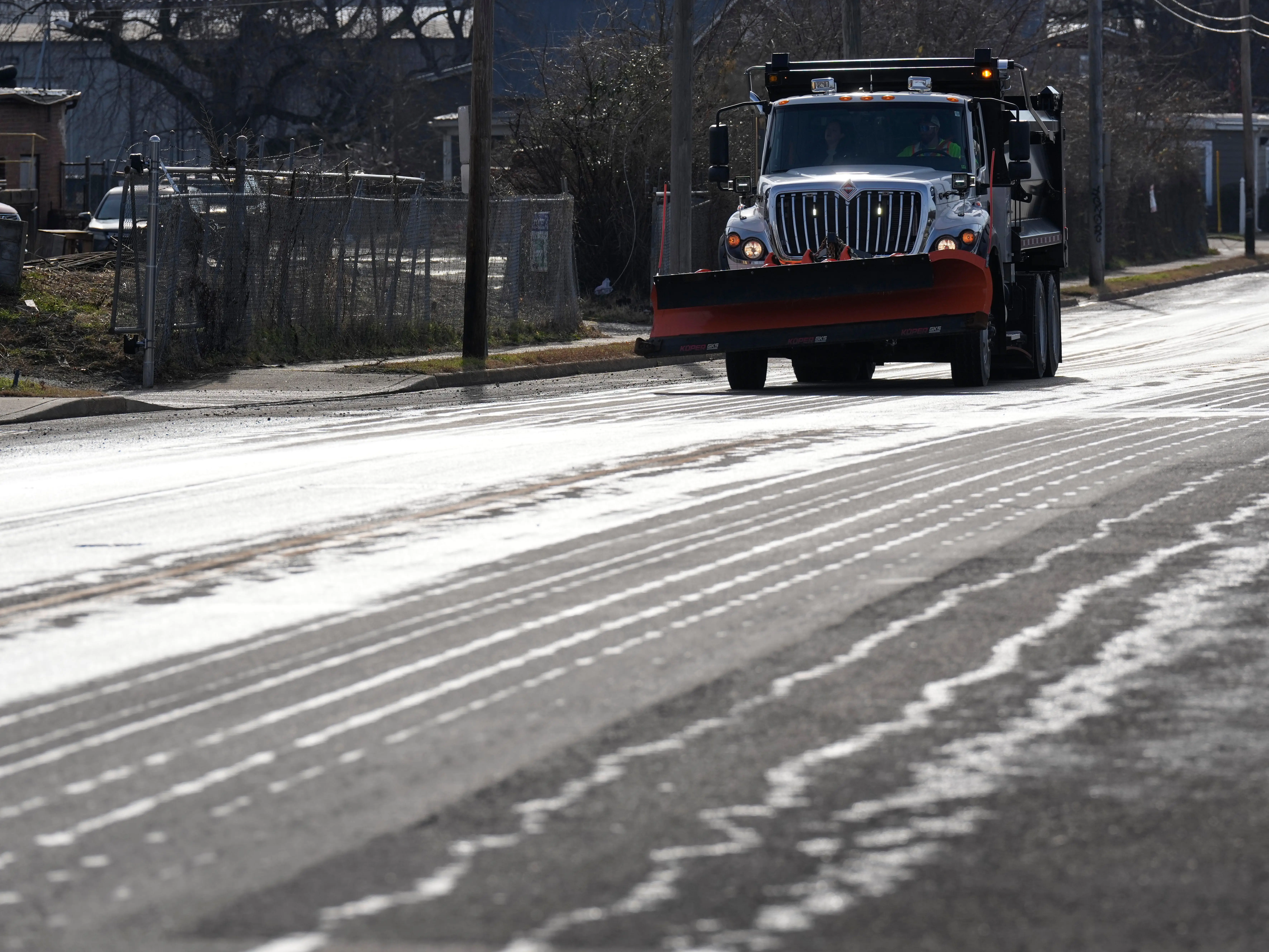 A Nashville Department of Transportation truck applies salt brine to a roadway Thursday, Jan. 22, 2026, in Nashville, Tenn. ahead of a winter storm expected to hit the state over the weekend.