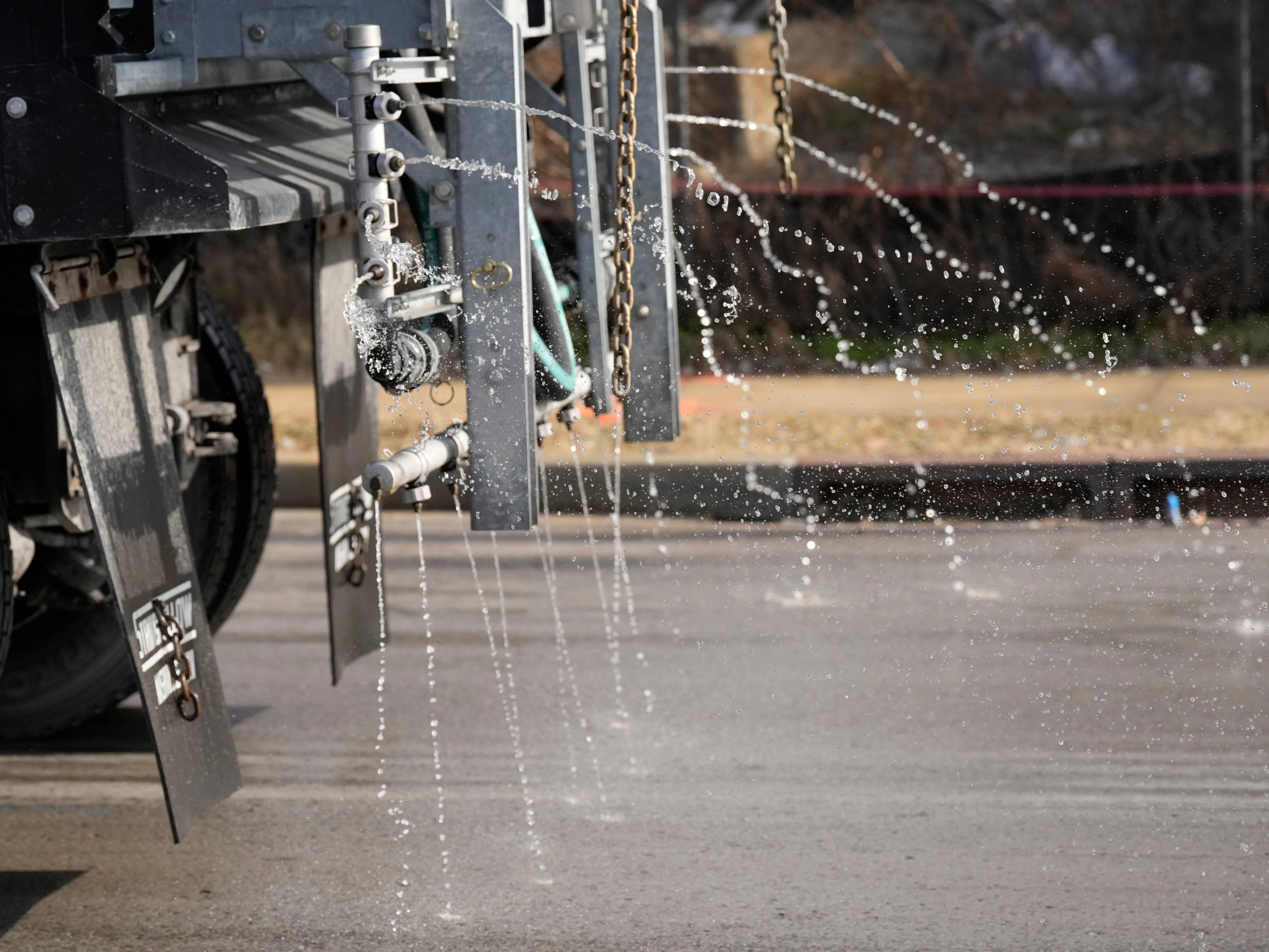 A Nashville Department of Transportation truck applies salt brine to a roadway Thursday, Jan. 22, 2026, in Nashville, Tenn. ahead of a winter storm expected to hit the state over the weekend.