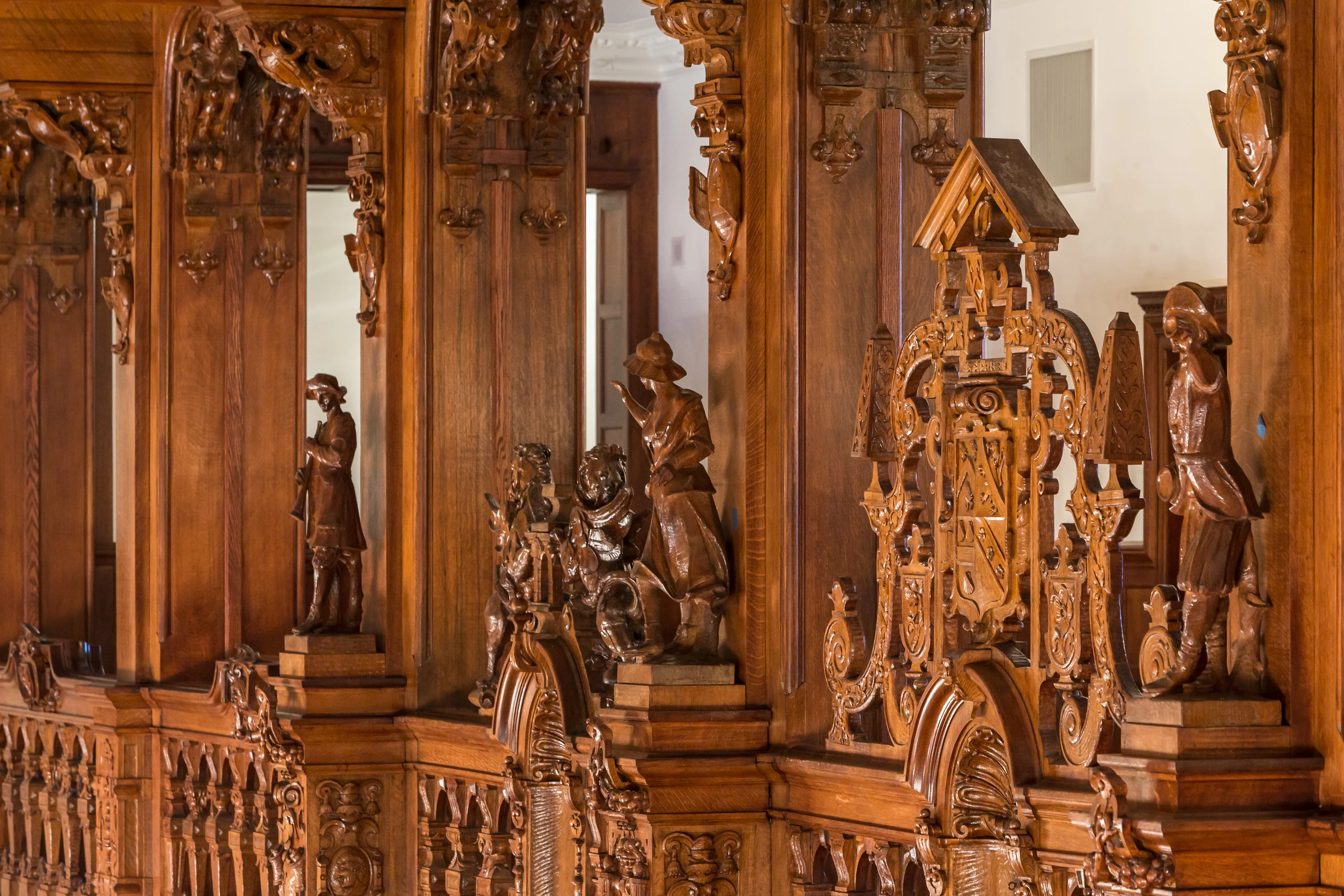 Intricate wood carvings grace the Great Hall fireplace at the Crocker-McMillin mansion.