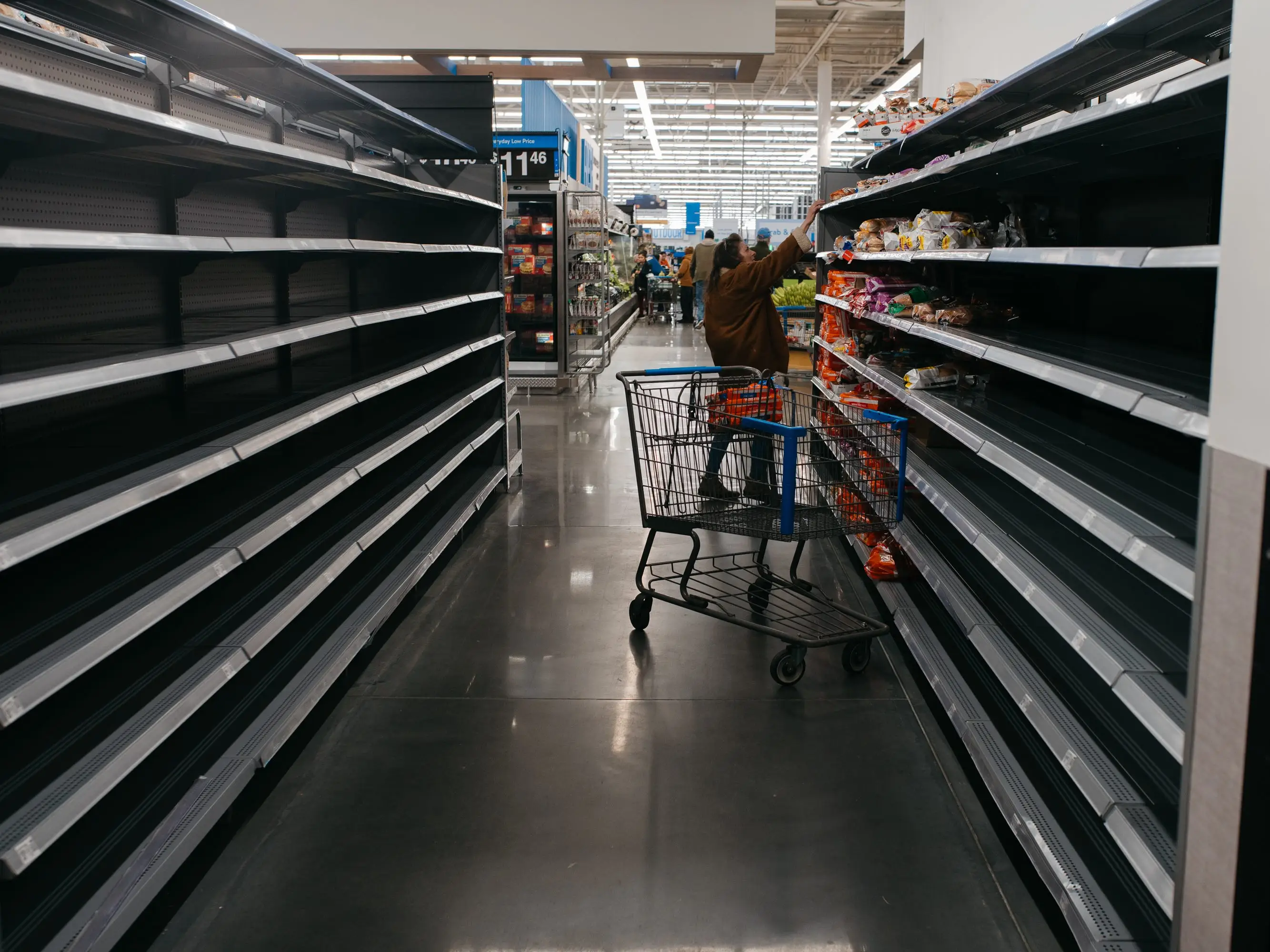 Shoppers cleared shelves in a Walmart in Morganton, North Carolina, ahead of winter storm Fern on Thursday, January 22, 2026
