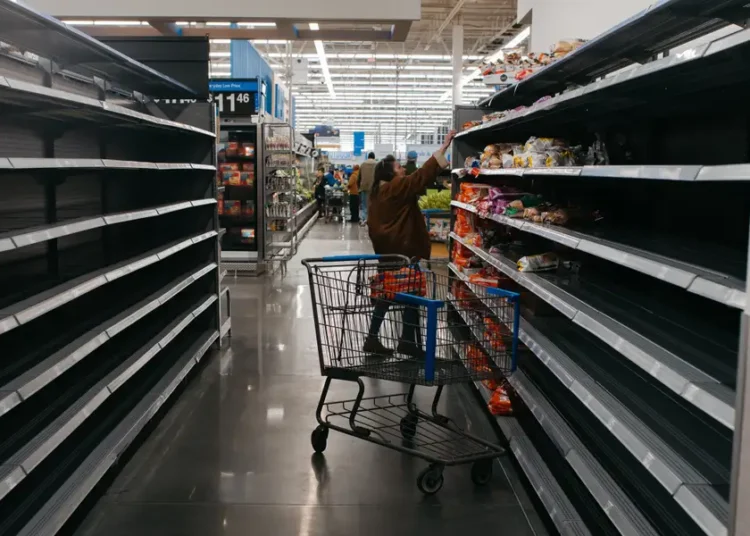 Photos show empty supermarket shelves as millions across the US brace for Winter Storm Fern