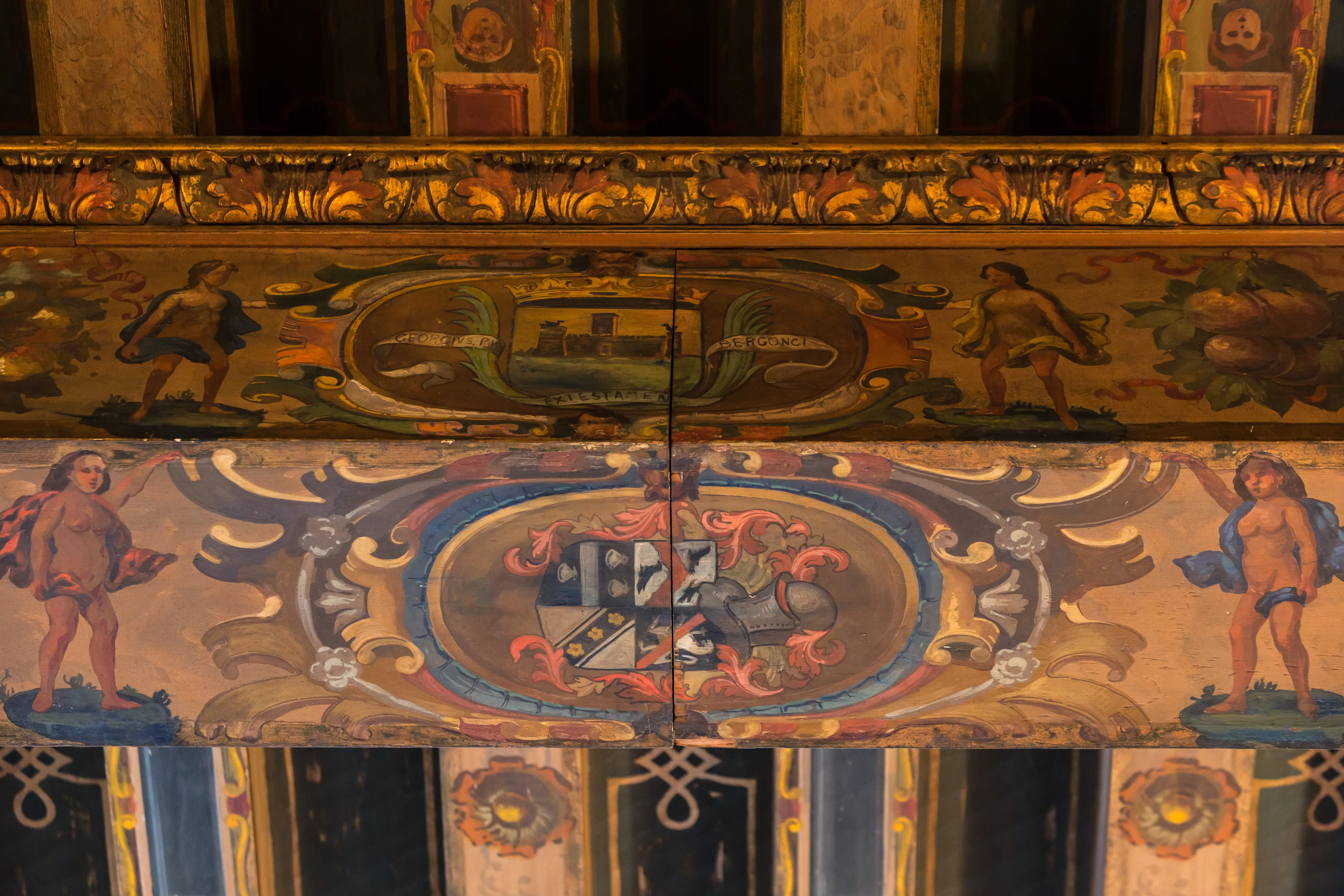 Hand-painted murals with gold trim still decorate the library ceiling at the Crocker-McMillin mansion.