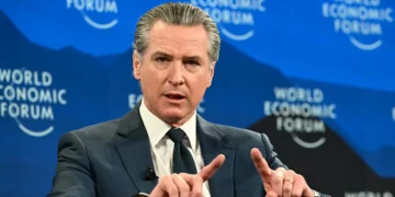 Gavin Newsom’s Davos trip mixed Trump criticism, a USA House snub, and bright-red kneepads