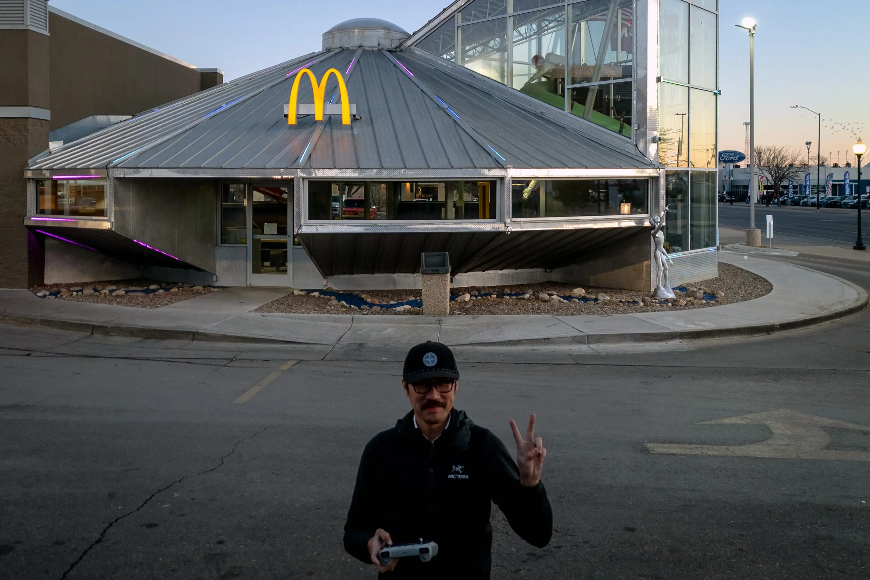 Gary He outside the UFO-shaped McDonald's in Roswell, New Mexico.