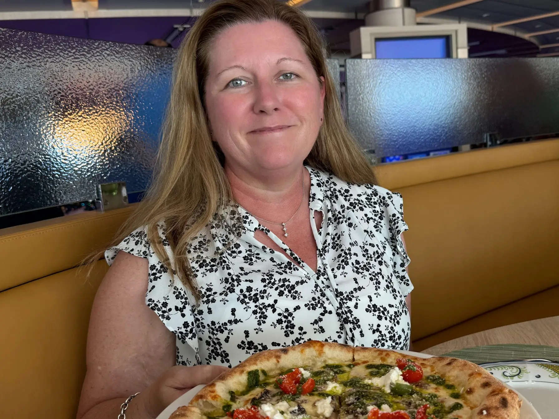 Cristine Struble with pizza in front of her