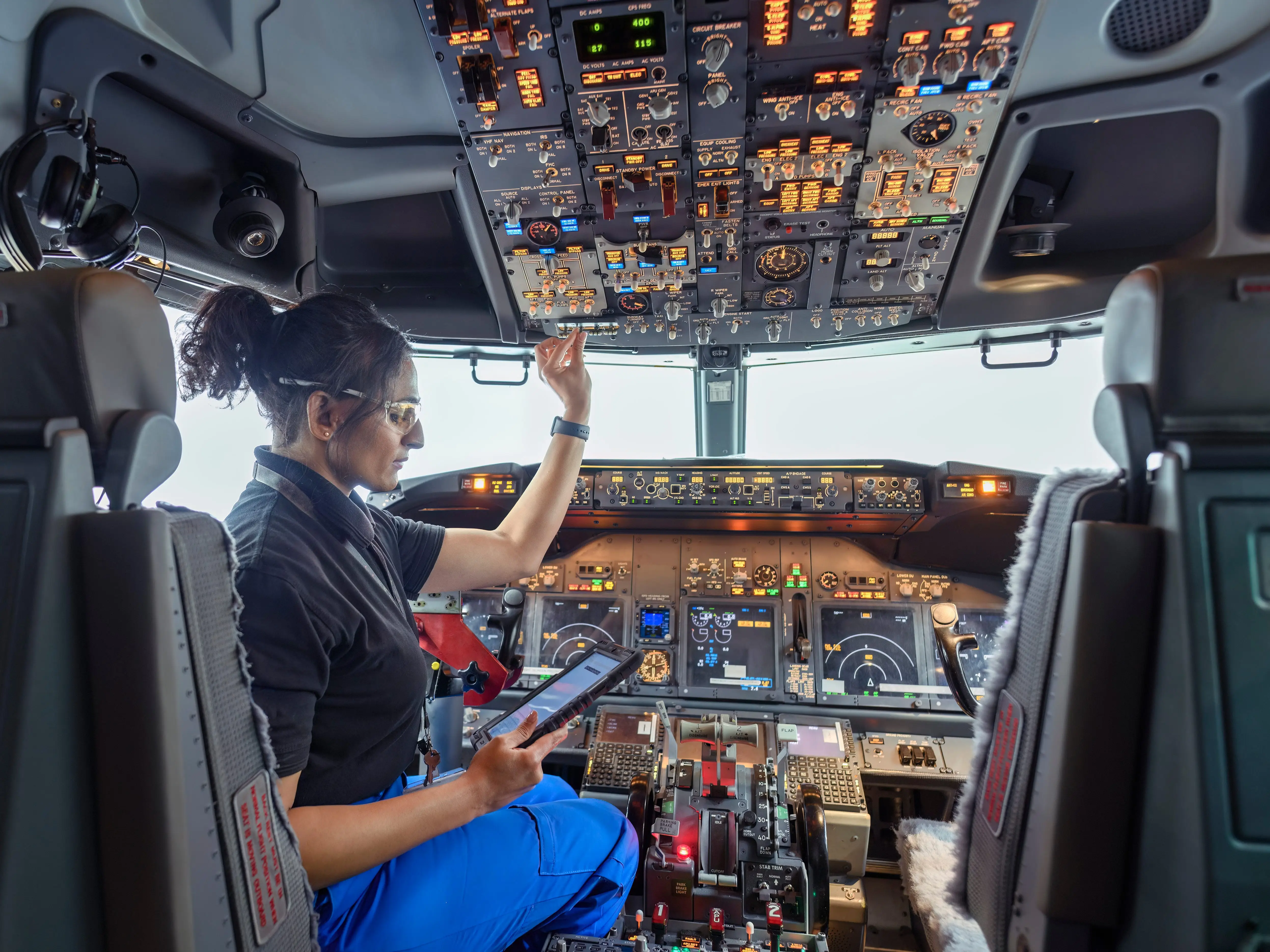 Avionics technician checking an aircraft