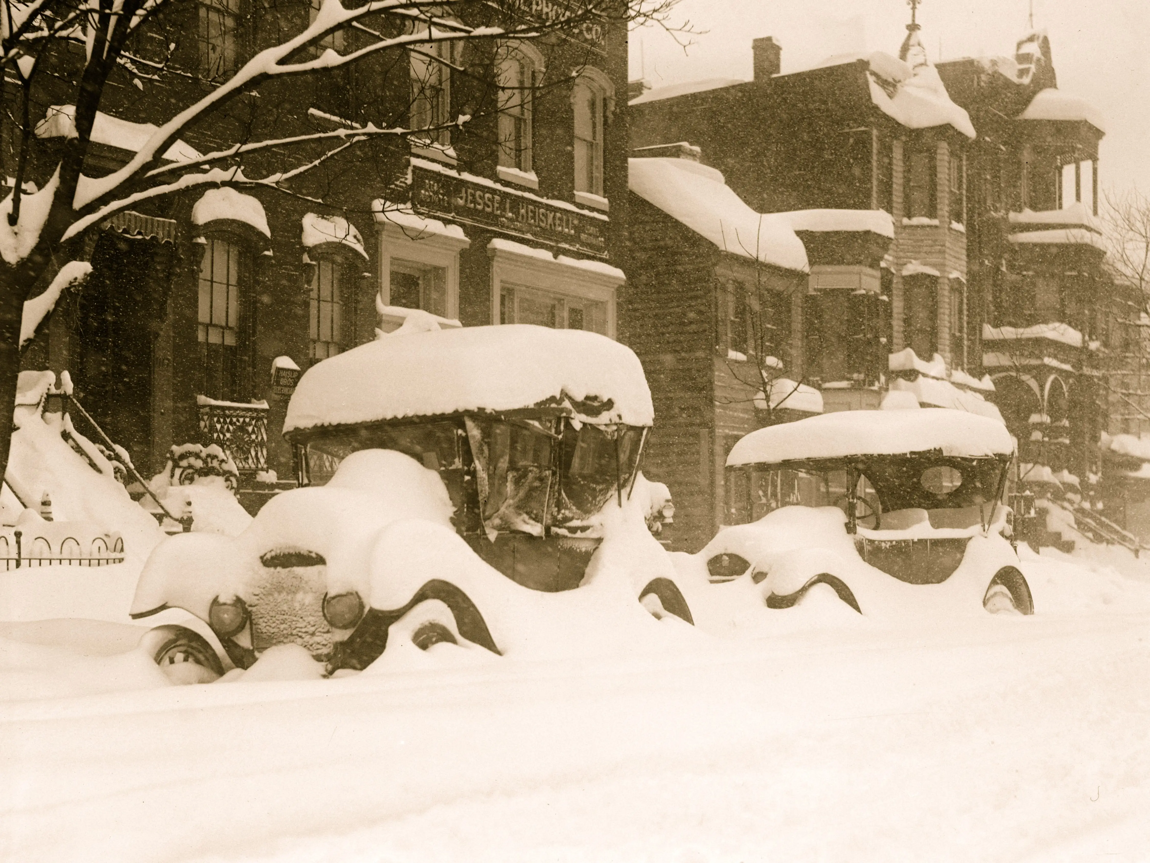 View of a cars buried in snow during the so-called Knickerbocker Storm, a blizzard that dropped 28 inches of snow on Washington DC, January 28, 1922.