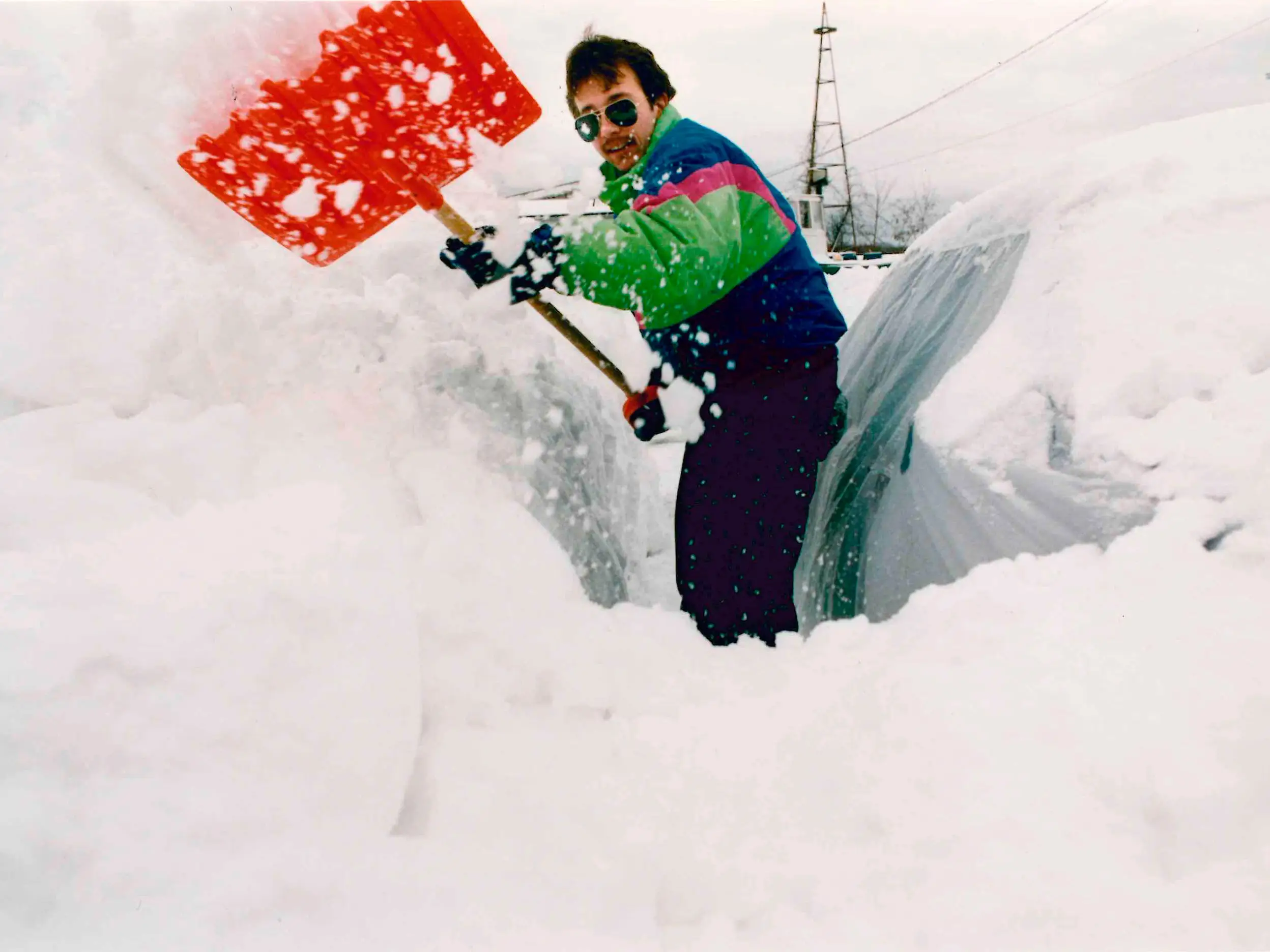 Dan Littlefield of Campe Ellis attempts to clear snow from his car Sunday morning, March 14, 1993. 