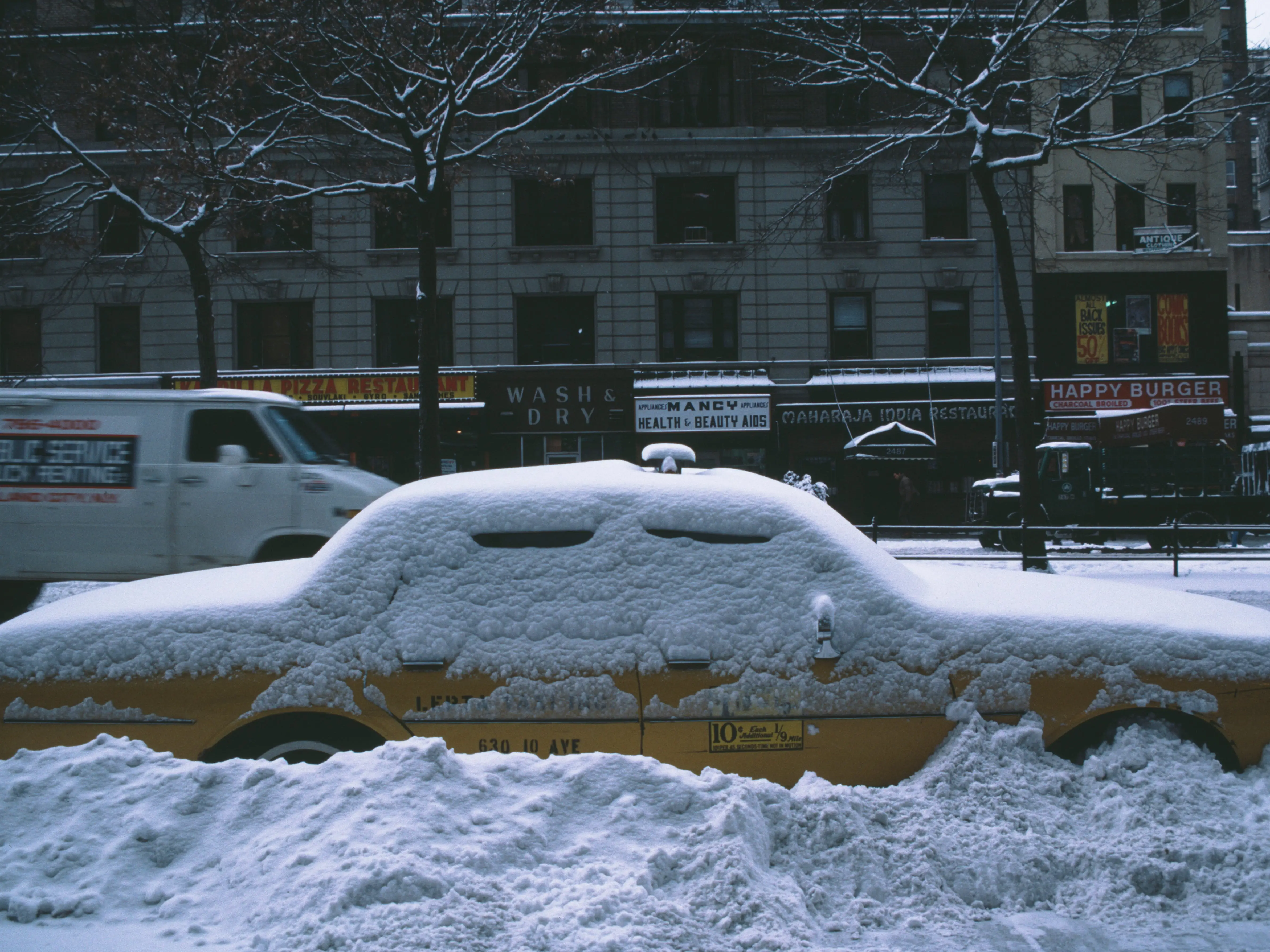 A taxi in the snow in Manhattan, New York City, during the blizzard of January 1996.