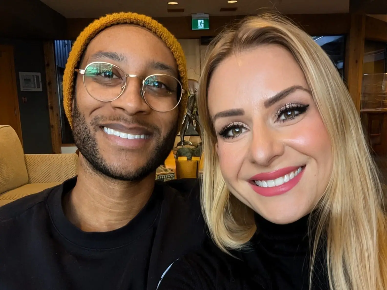 A man and a woman taking a selfie.