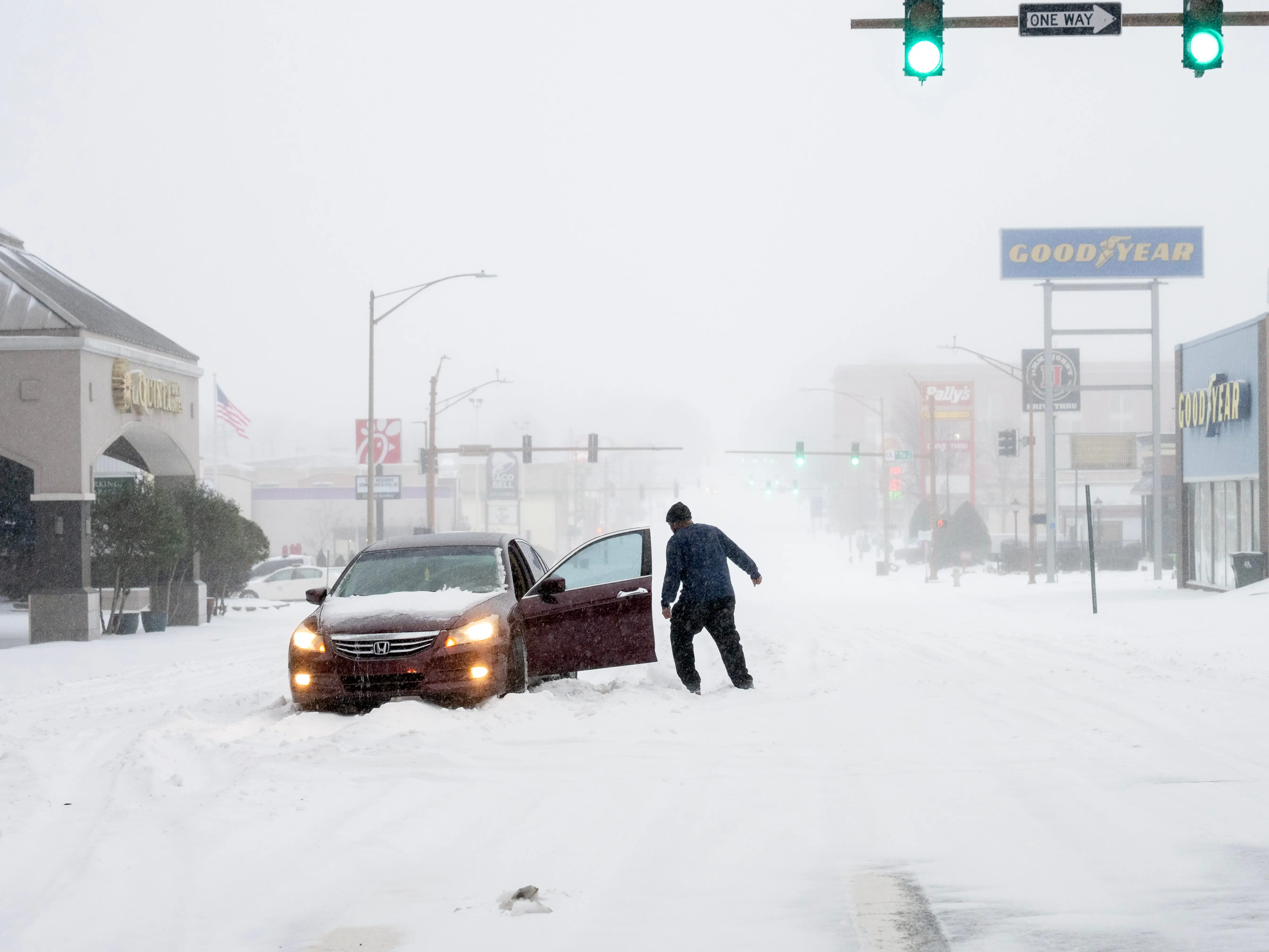 A person's car stuck in the snow on January 24, 2026 in Little Rock, Arkansas.
