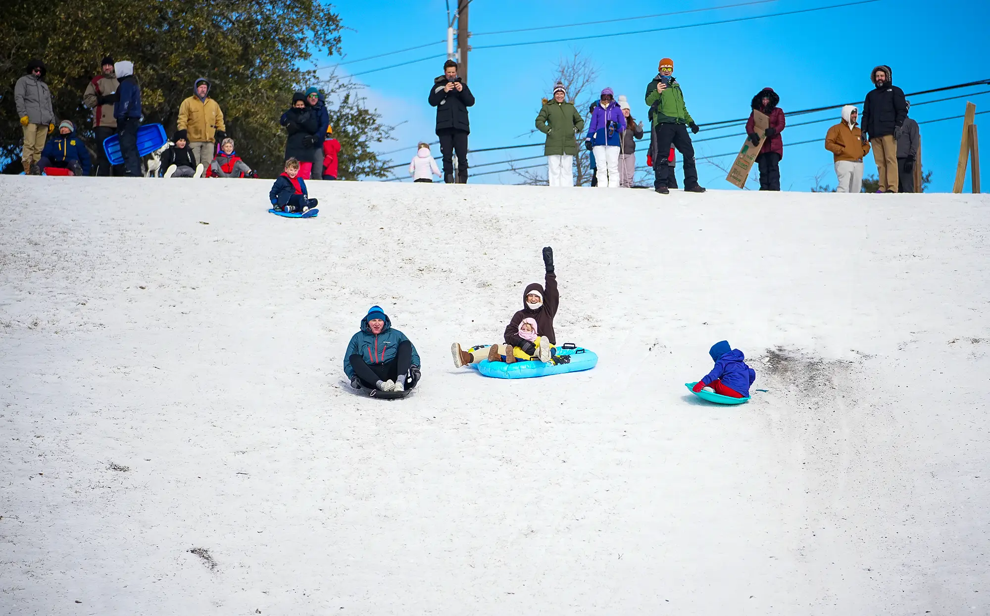 Sledding in Texas during the US winter storm.