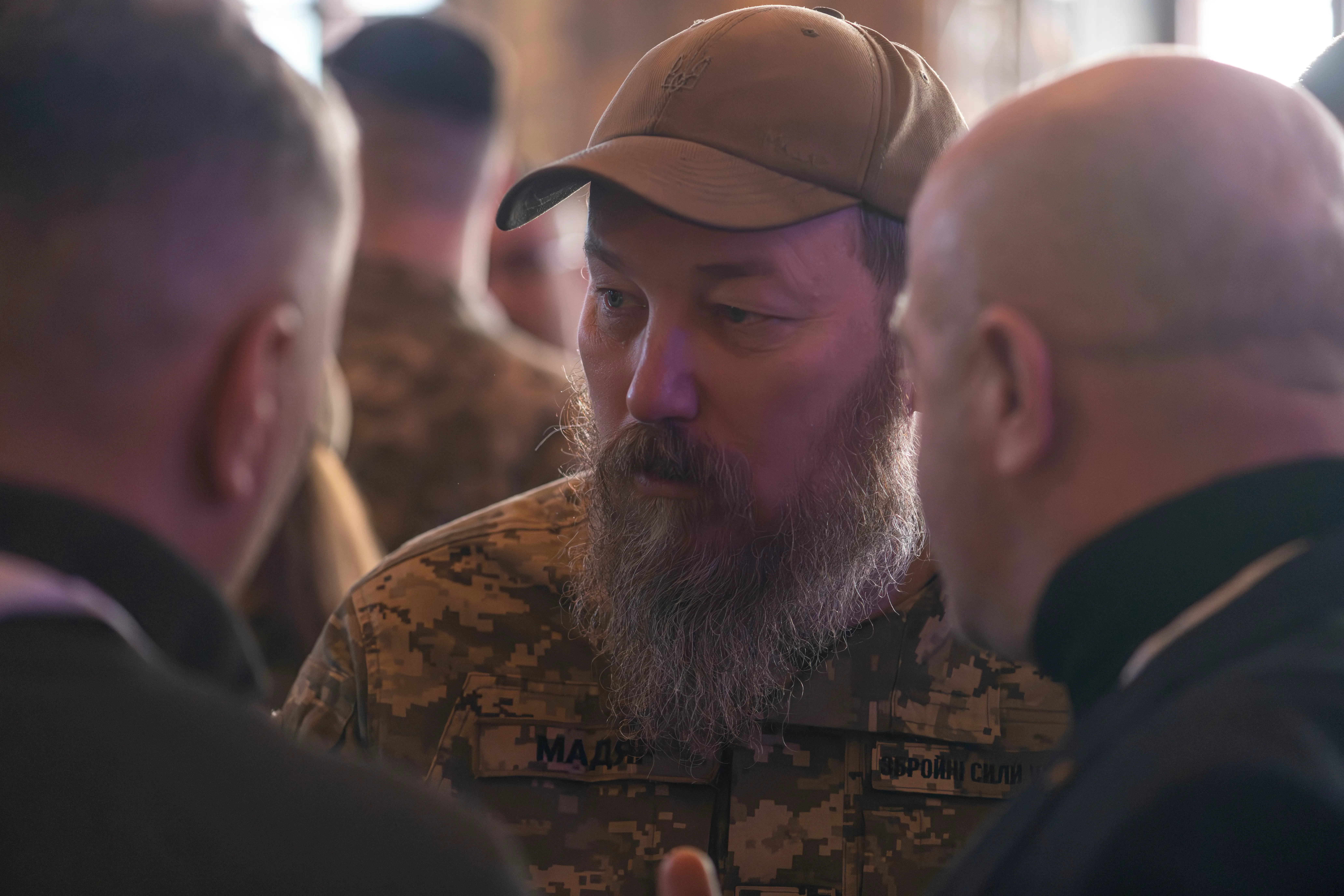 Madyar, in military fatigues and a baseball cap, speaks to Ukrainians.