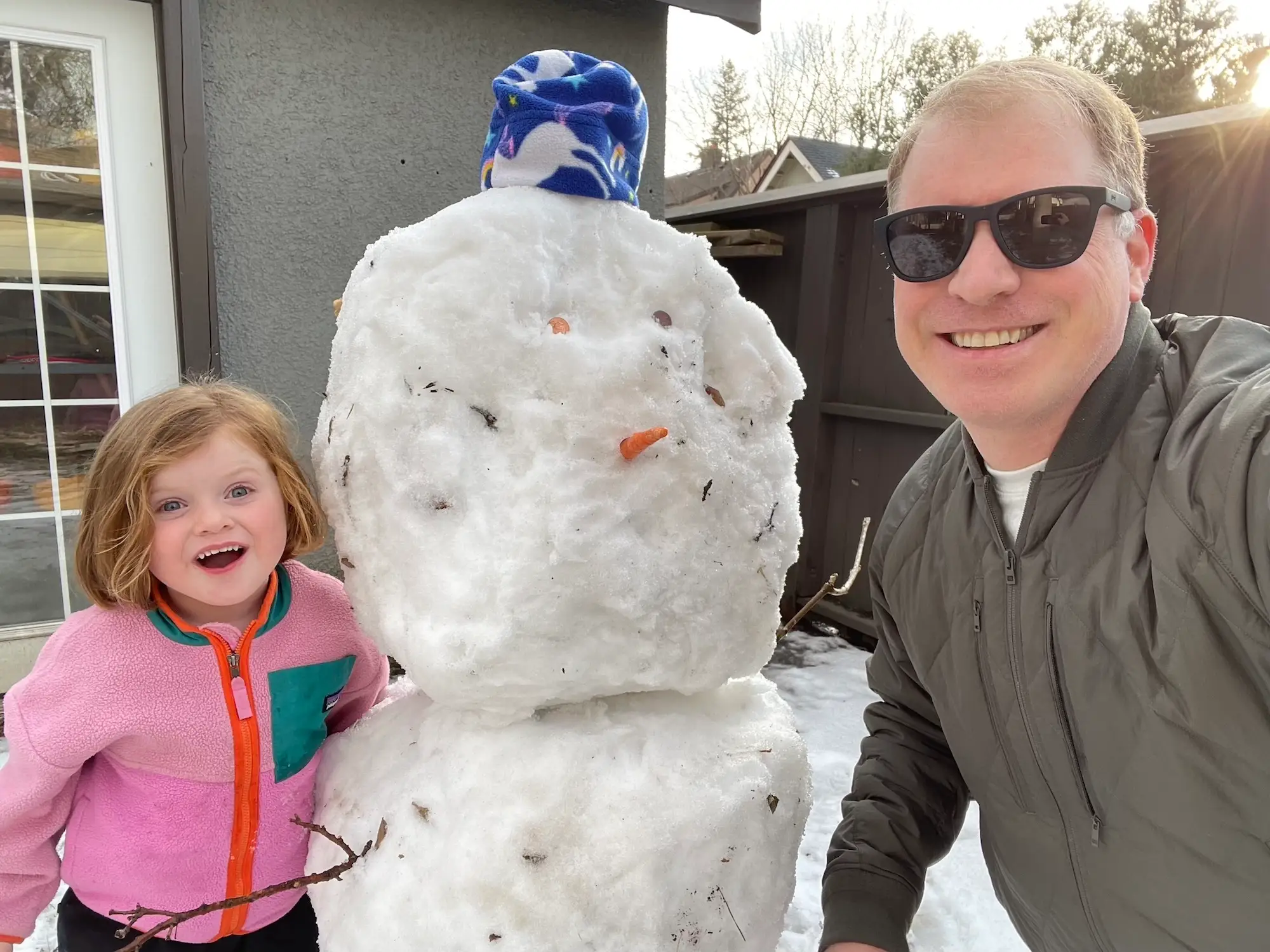 Dad and child playing in the snow