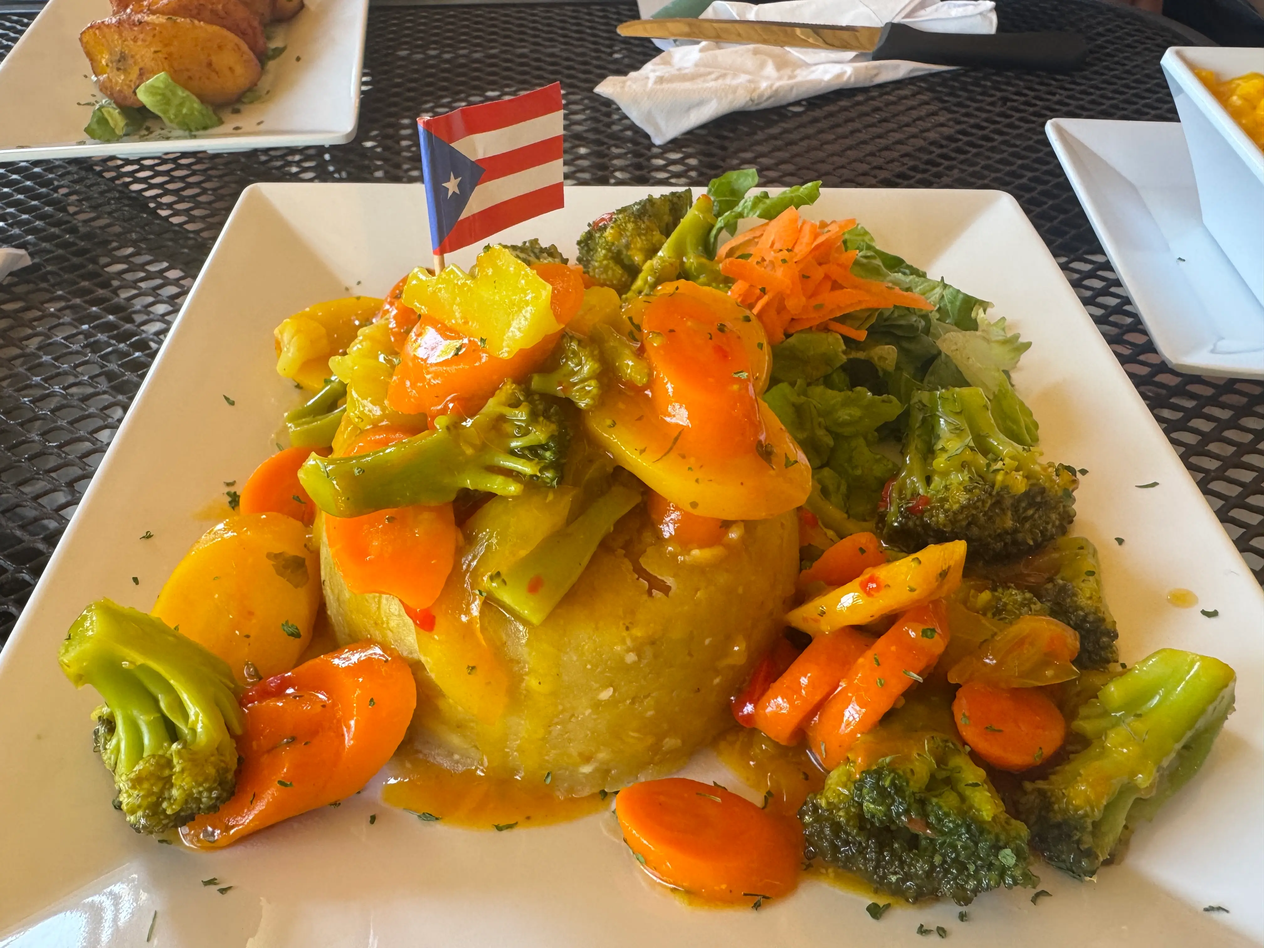 Mofongo with tiny Puerto Rico flag on it