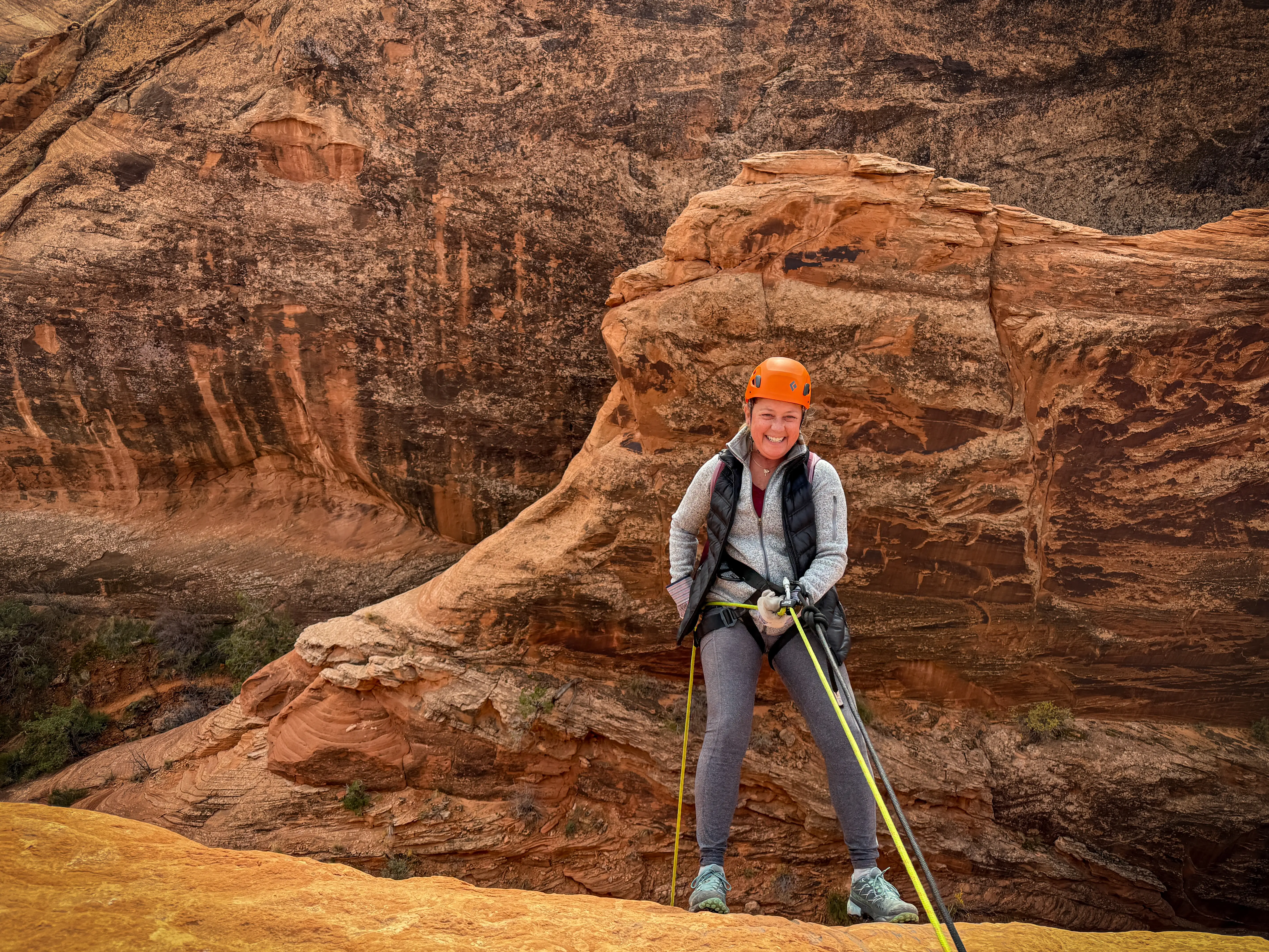 Author's mom rappelling at Bow and Arrow Canyon
