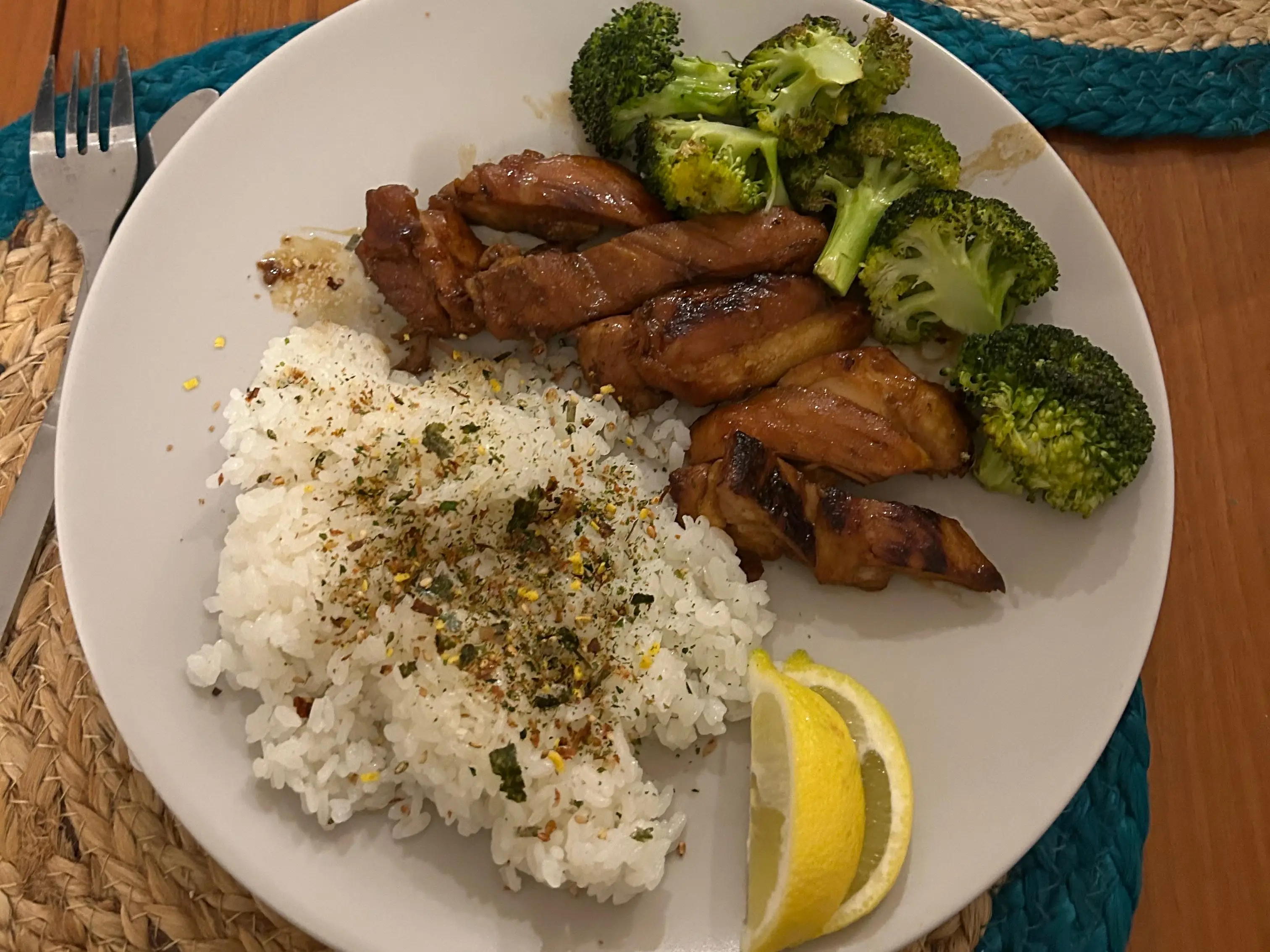 A plate of chicken teriyaki, broccoli, and rice.