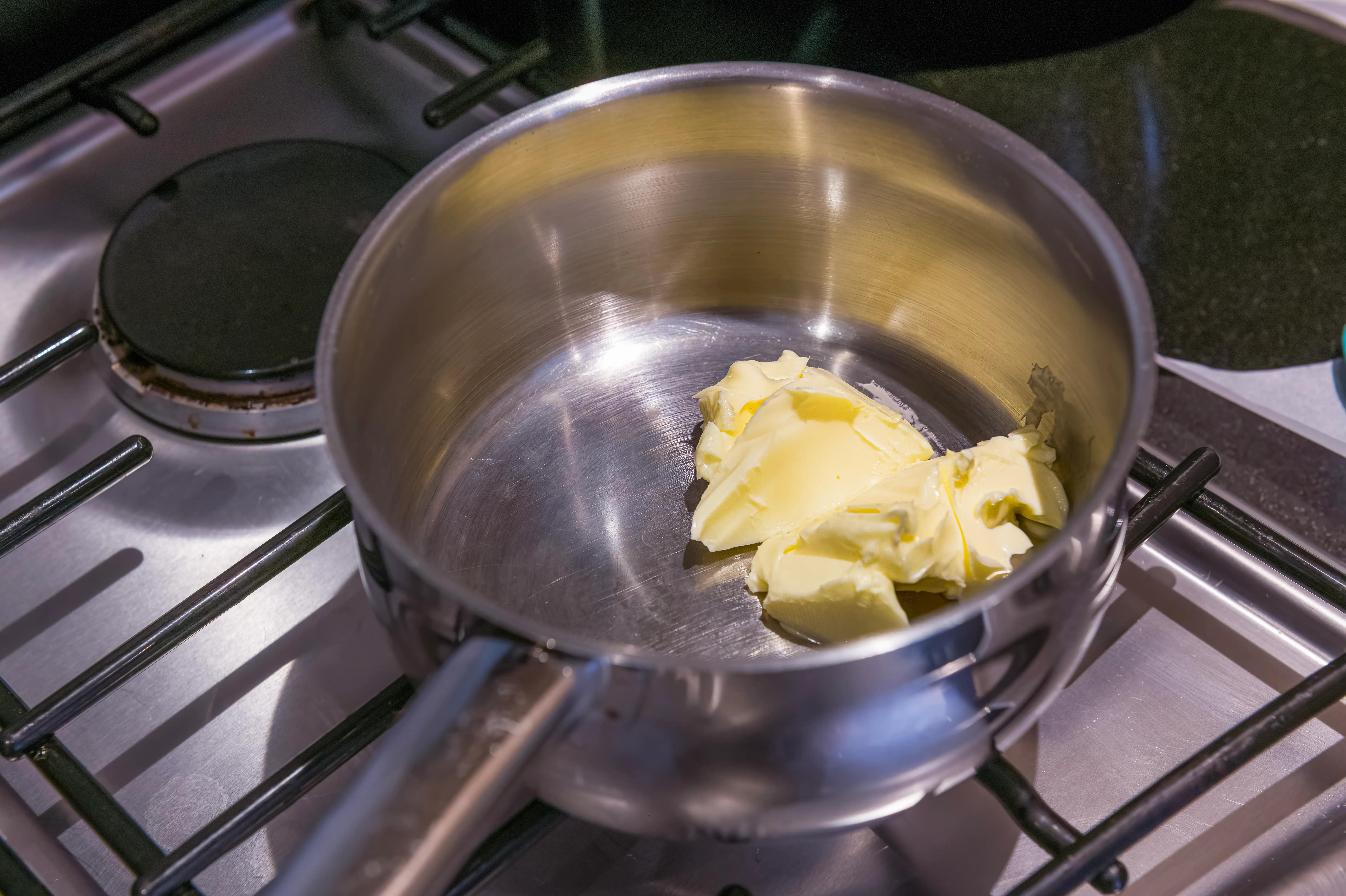 Butter melting in a pot on stovetop