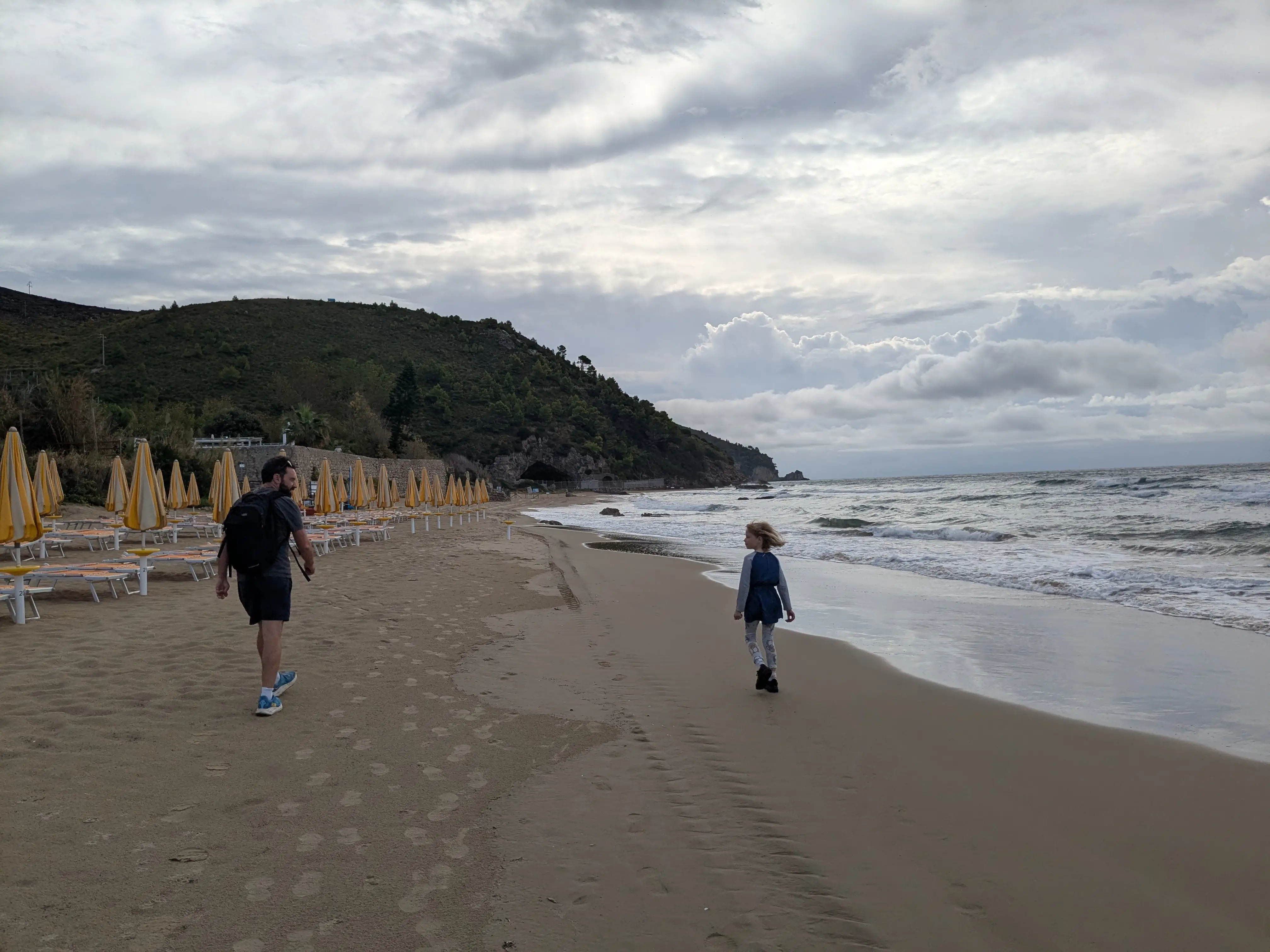 Tegan Forder's daughter and husband walking on Italianbeach
