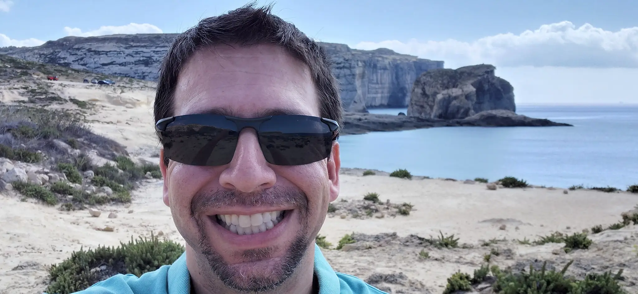 A selfie of a man at the beach in Malta.