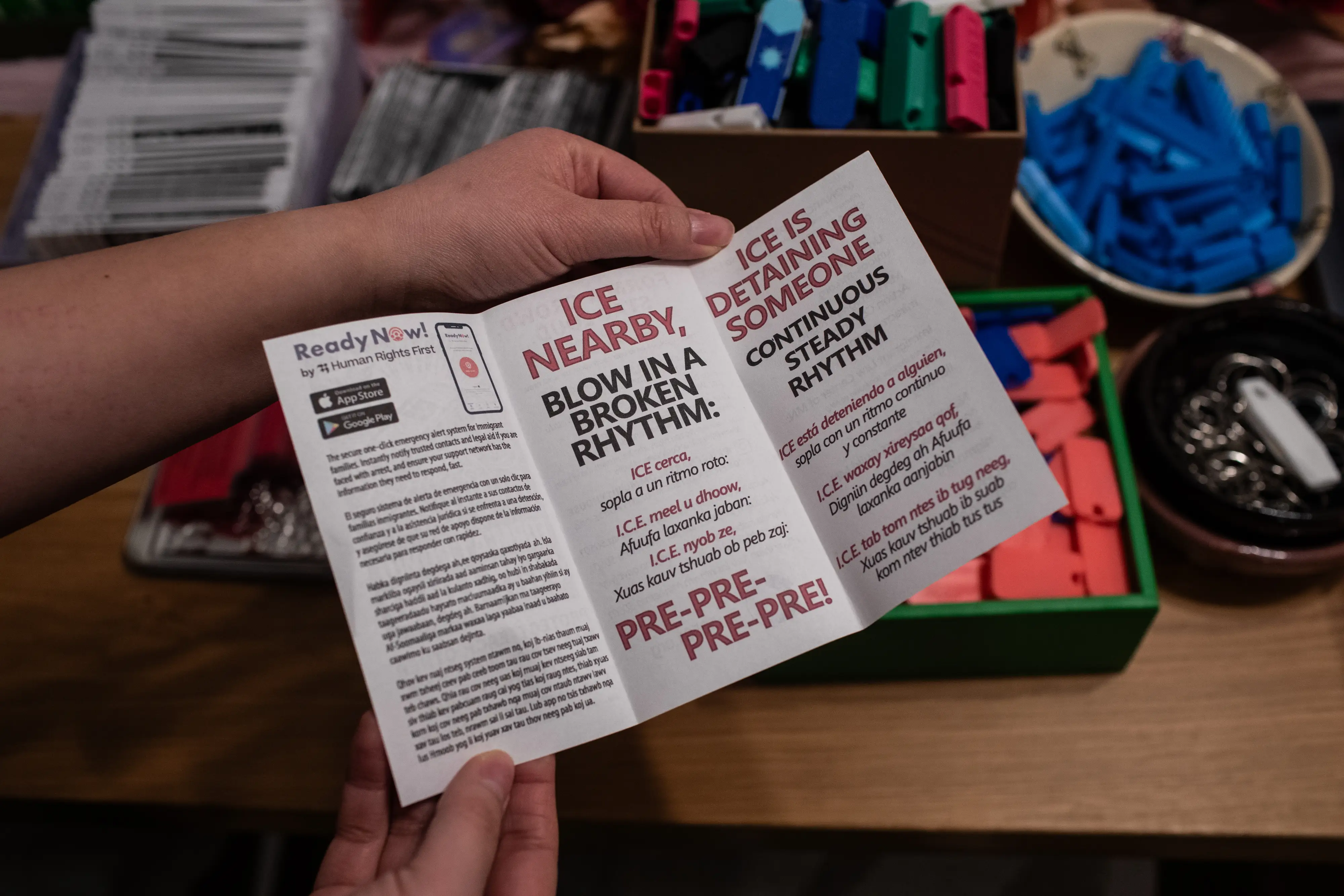 A pamphlet included with 3D printed whistles.