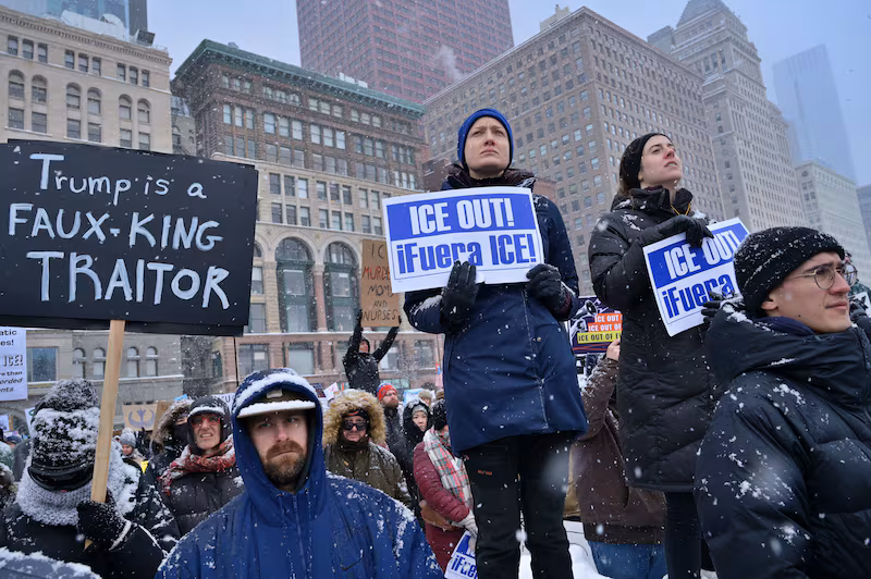 Demonstrators gather on Michigan Avenue during a heavy snowstorm to protest against U.S. Immigration and Customs Enforcement (ICE) and Customs and Border Protection (CBP) in Chicago, US on January 25, 2026.