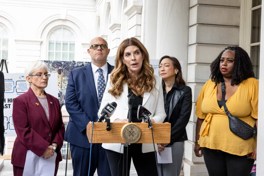 NYC Council Member Julie Menin speaks at a press conference outside City Hall, advocating for further funding of the 9/11 Victims Fund.